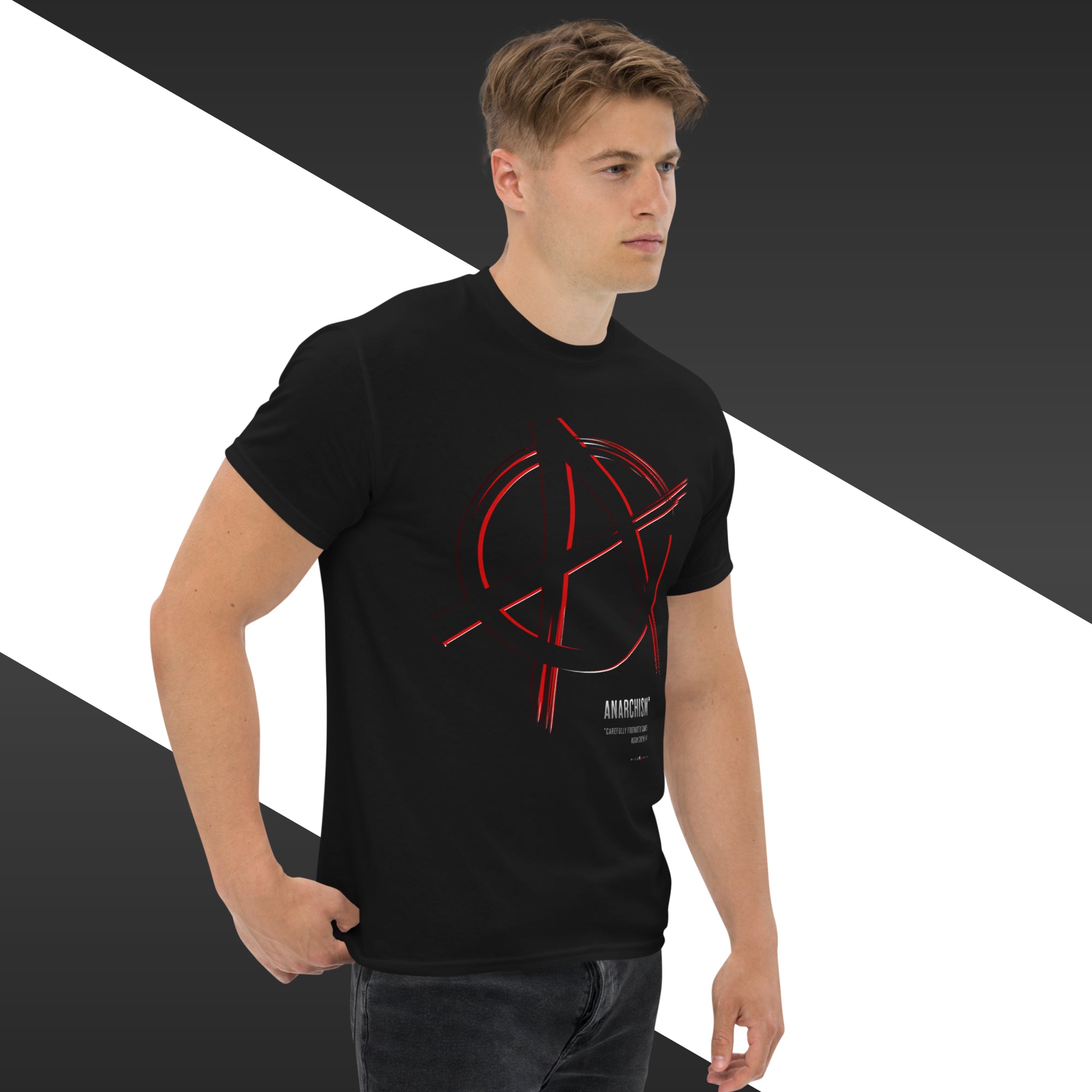 Man wearing a black t-shirt with a red graphic design on a black and white background