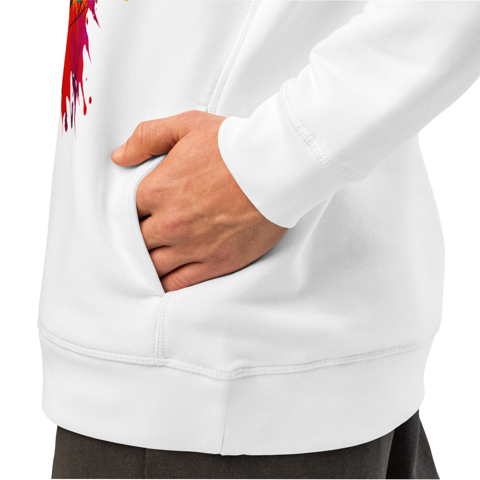 White hoodie with a colorful design on the sleeve, worn by a person with a hand in the pocket.