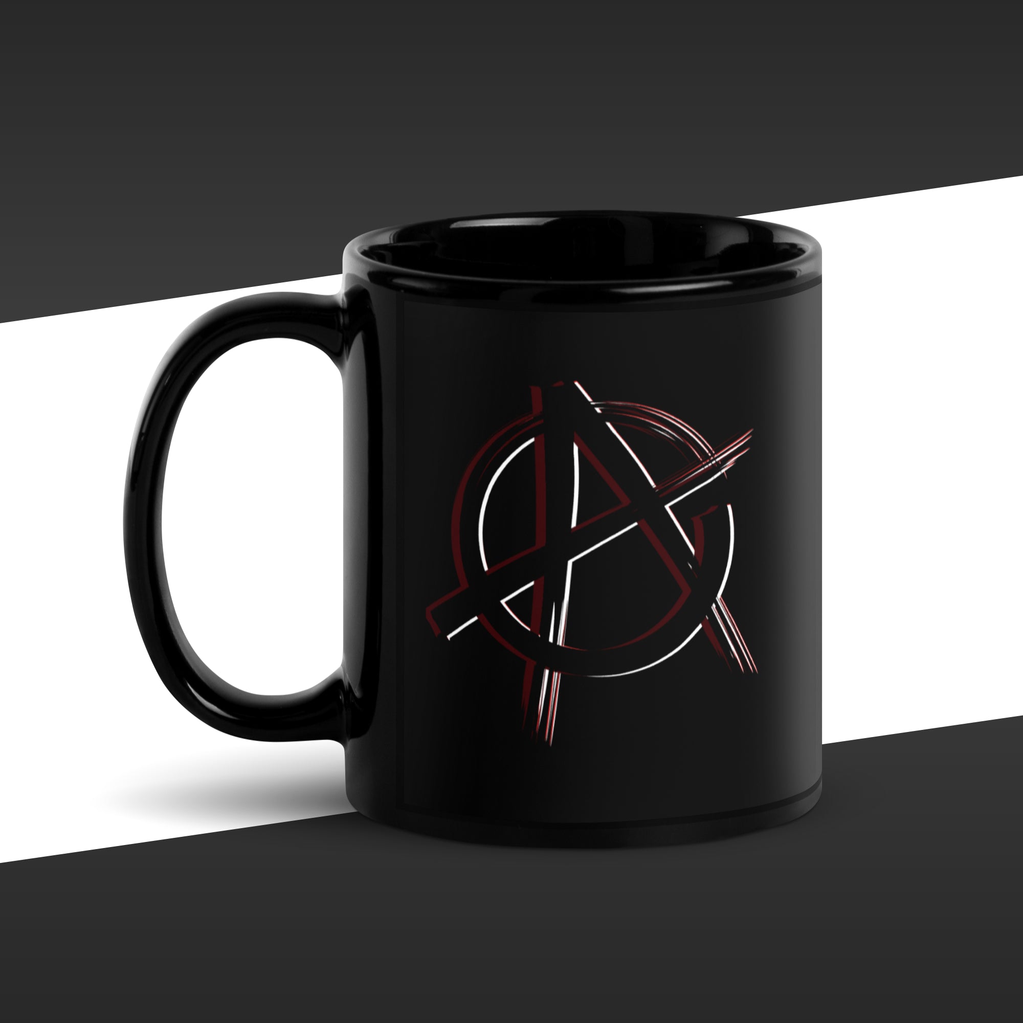 Black mug with a red and white anarchy symbol design on