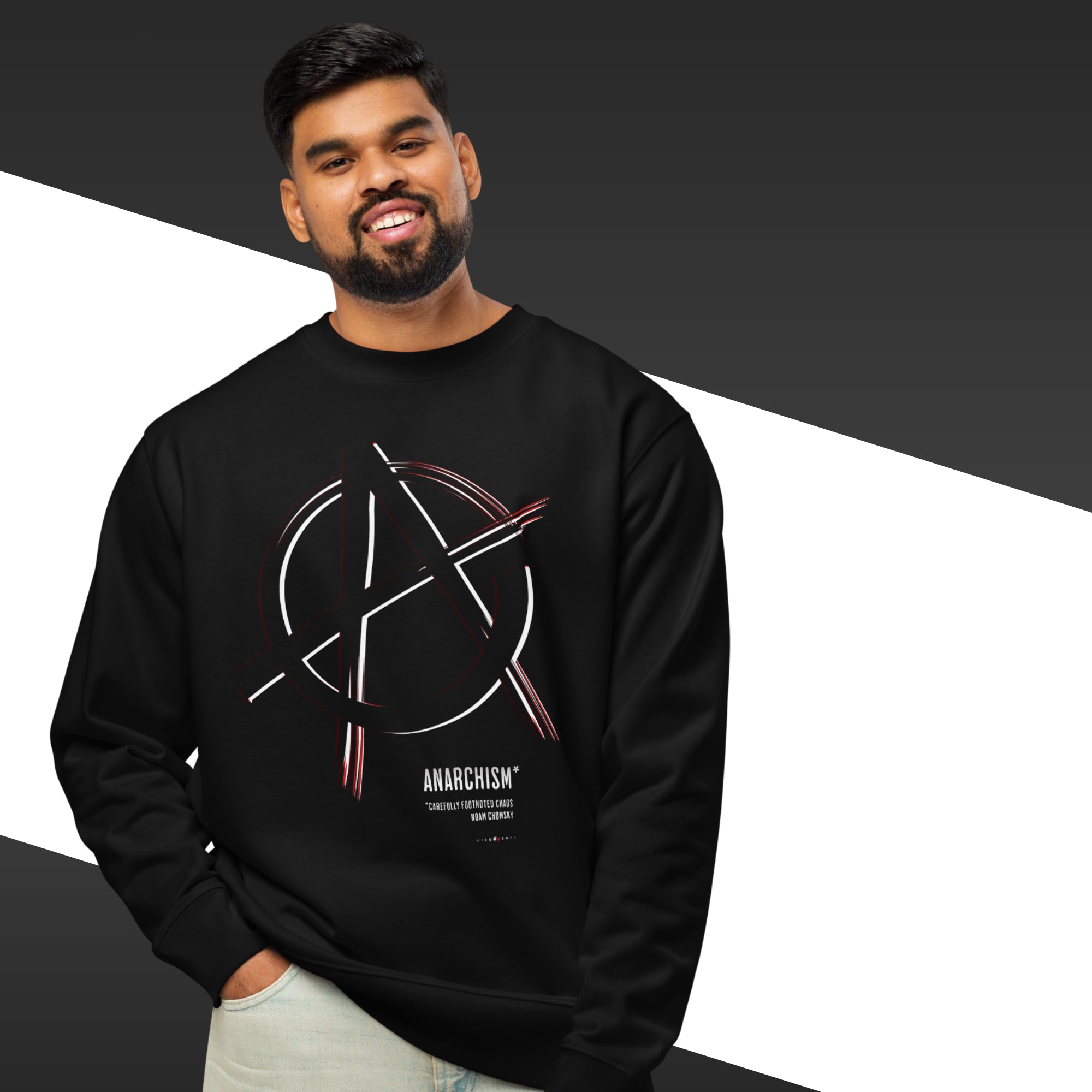 Man wearing a black sweatshirt with an anarchy symbol design on a white background