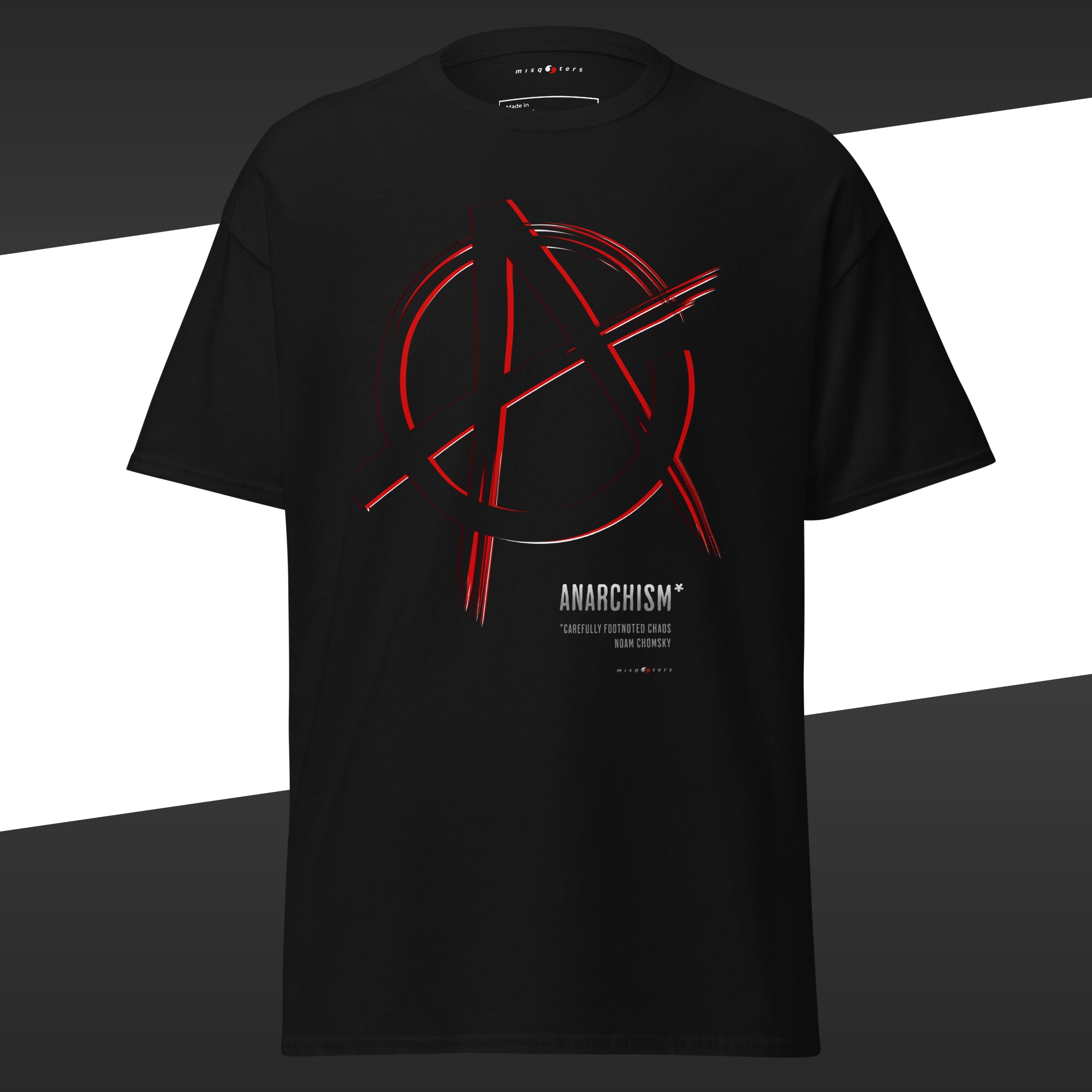 Black t-shirt with a red anarchism symbol featuring the fake quote "Anarchism, carefully footnoted chaos"