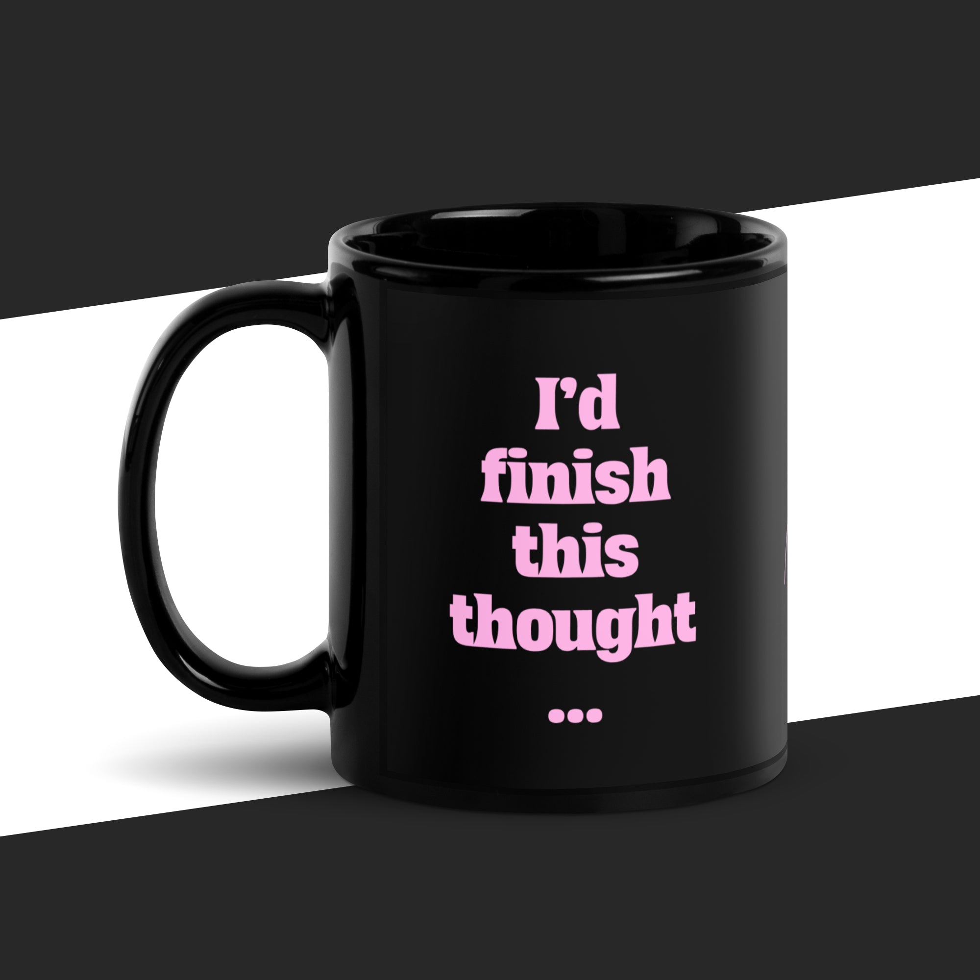 Black mug with pink text 'I'd finish this thought...' on a black and white background