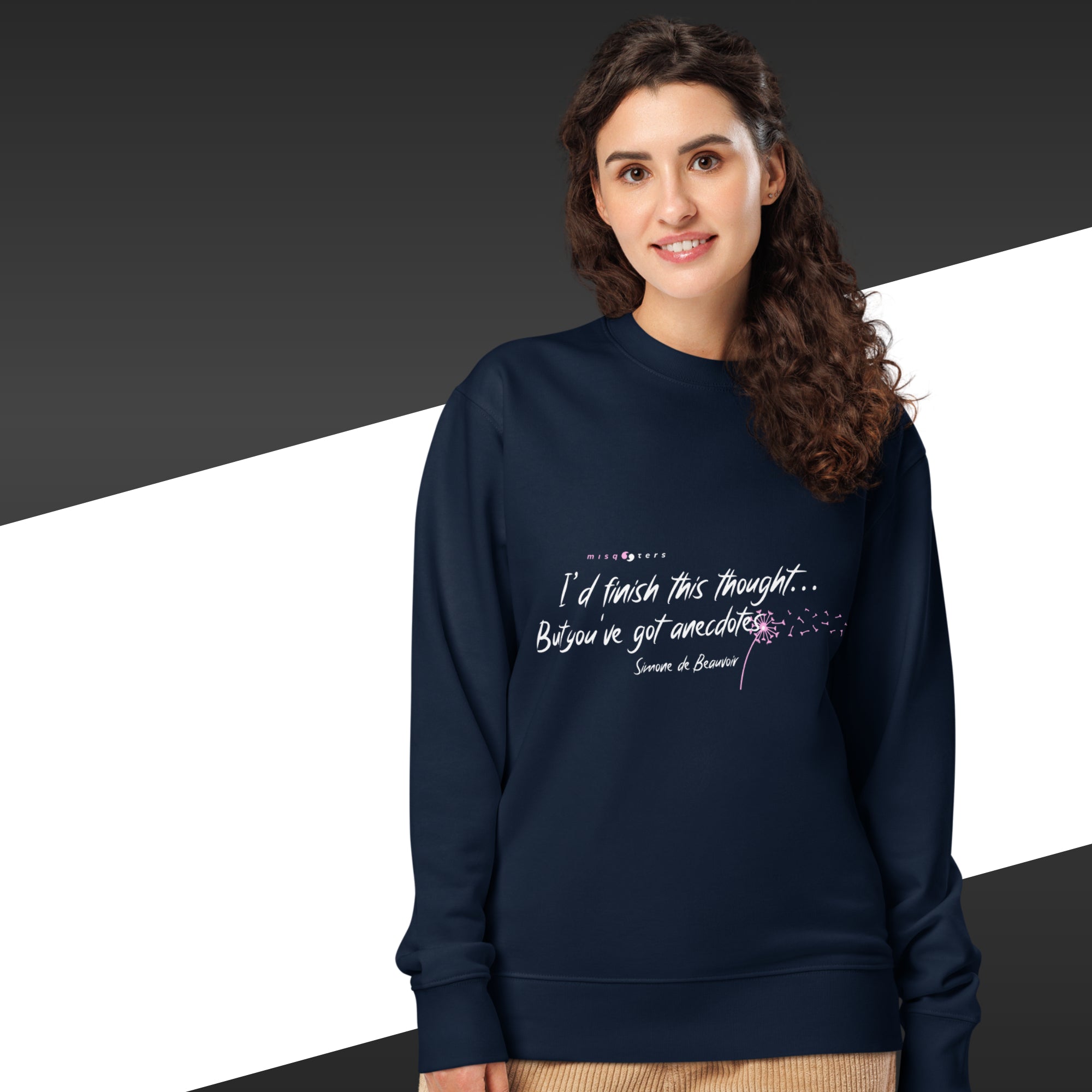 Woman with a navy blue sweatshirt and a white and pink Simone de Beauvoir quote on it