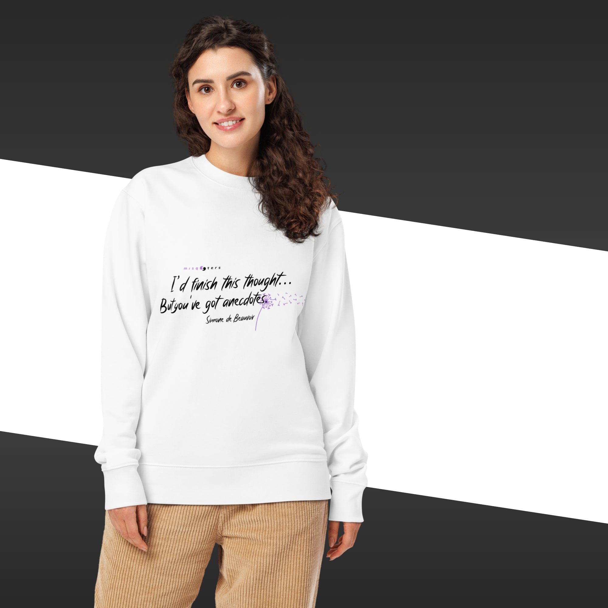 Woman with a white sweatshirt and a white and purple Simone de Beauvoir quote on it