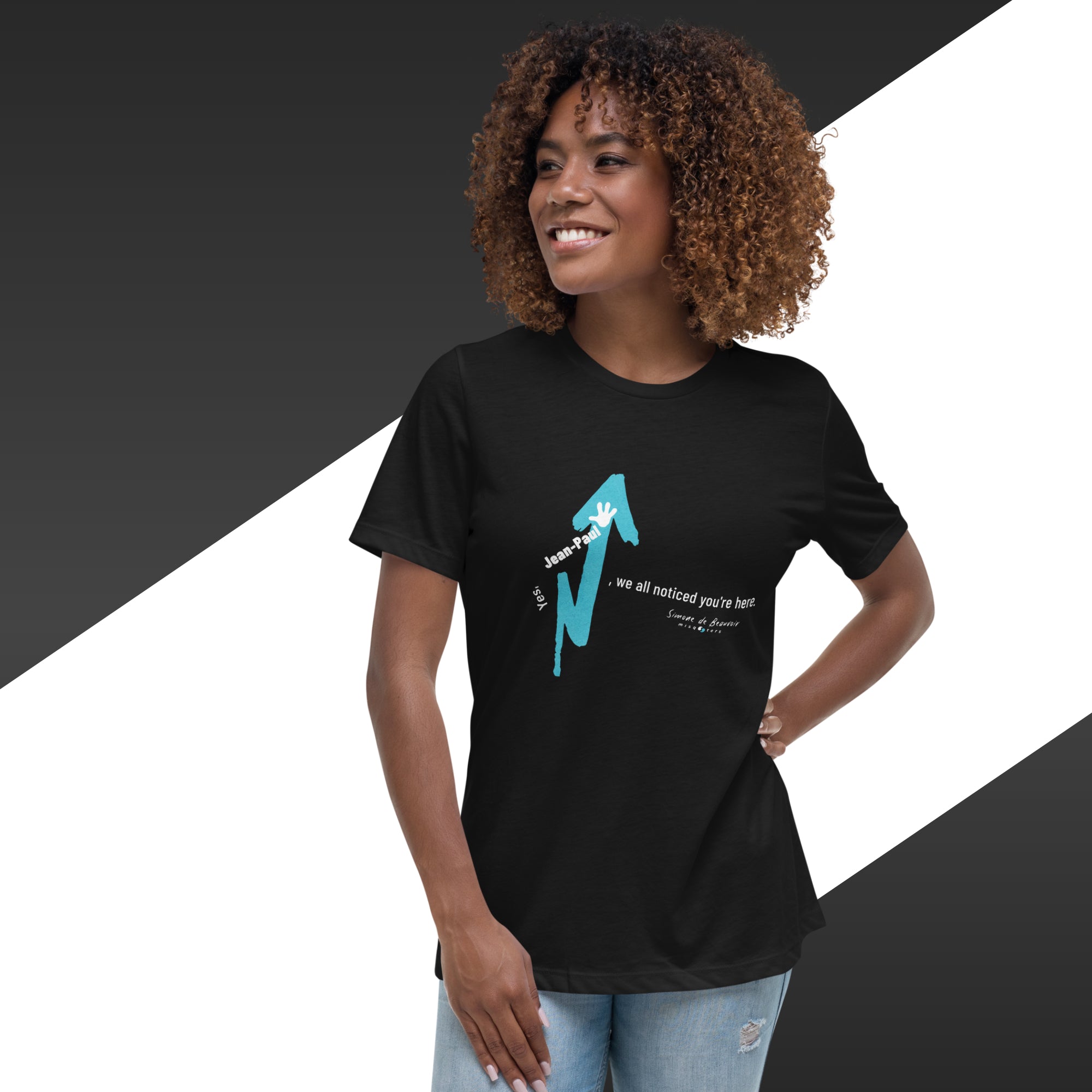 Woman wearing a black t-shirt with a blue graphic design on a black and white background