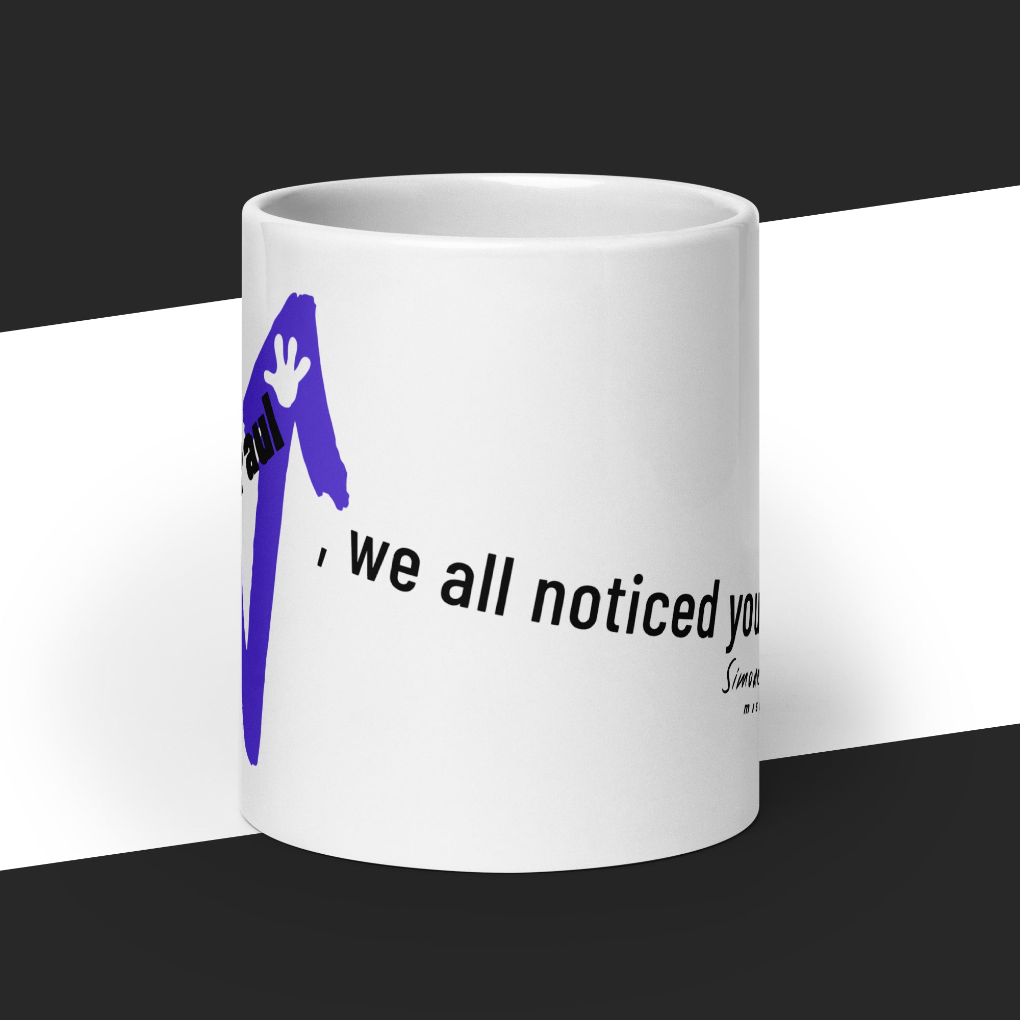 White mug with text and a purple arrow on it