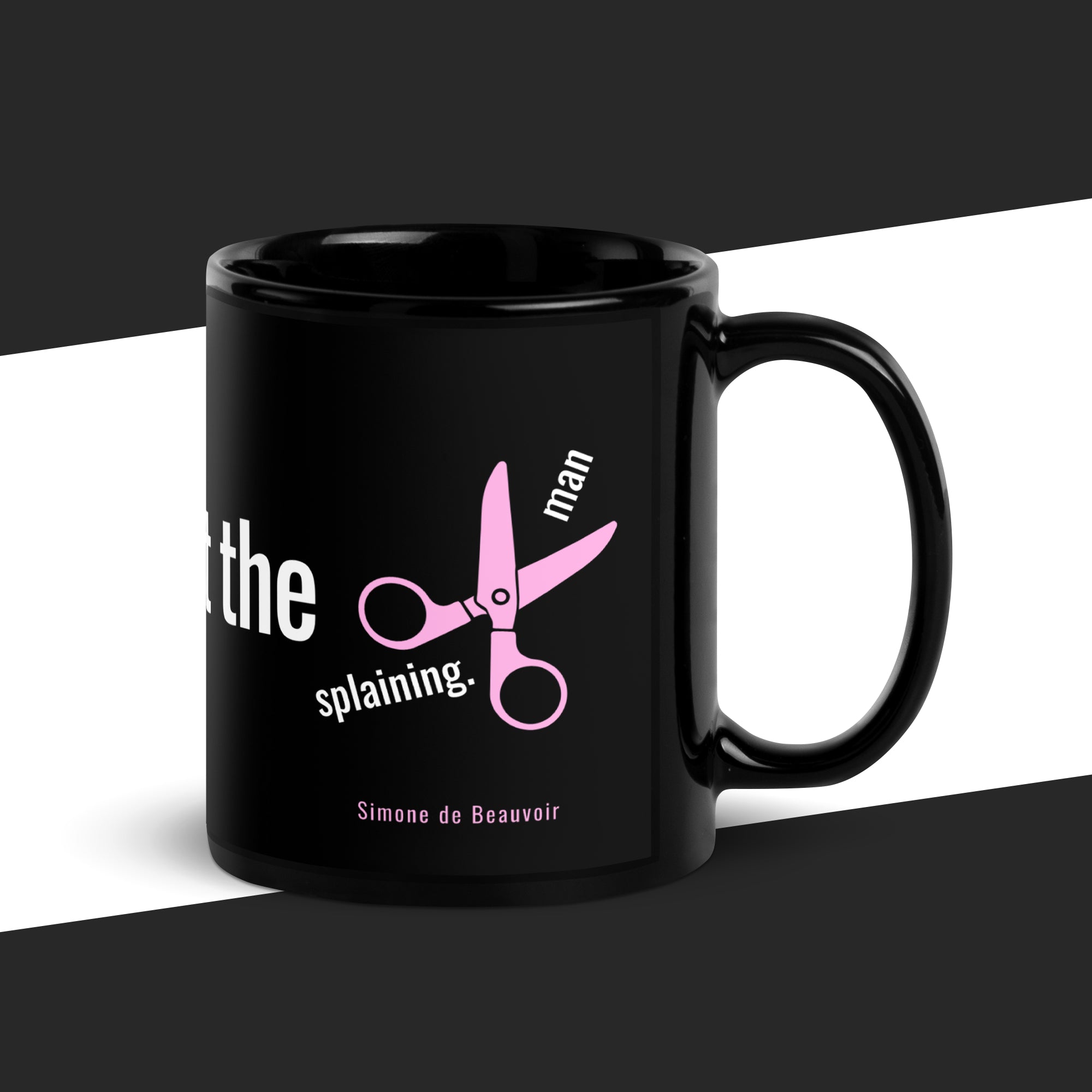 Black mug with pink scissors and text on a black and white background