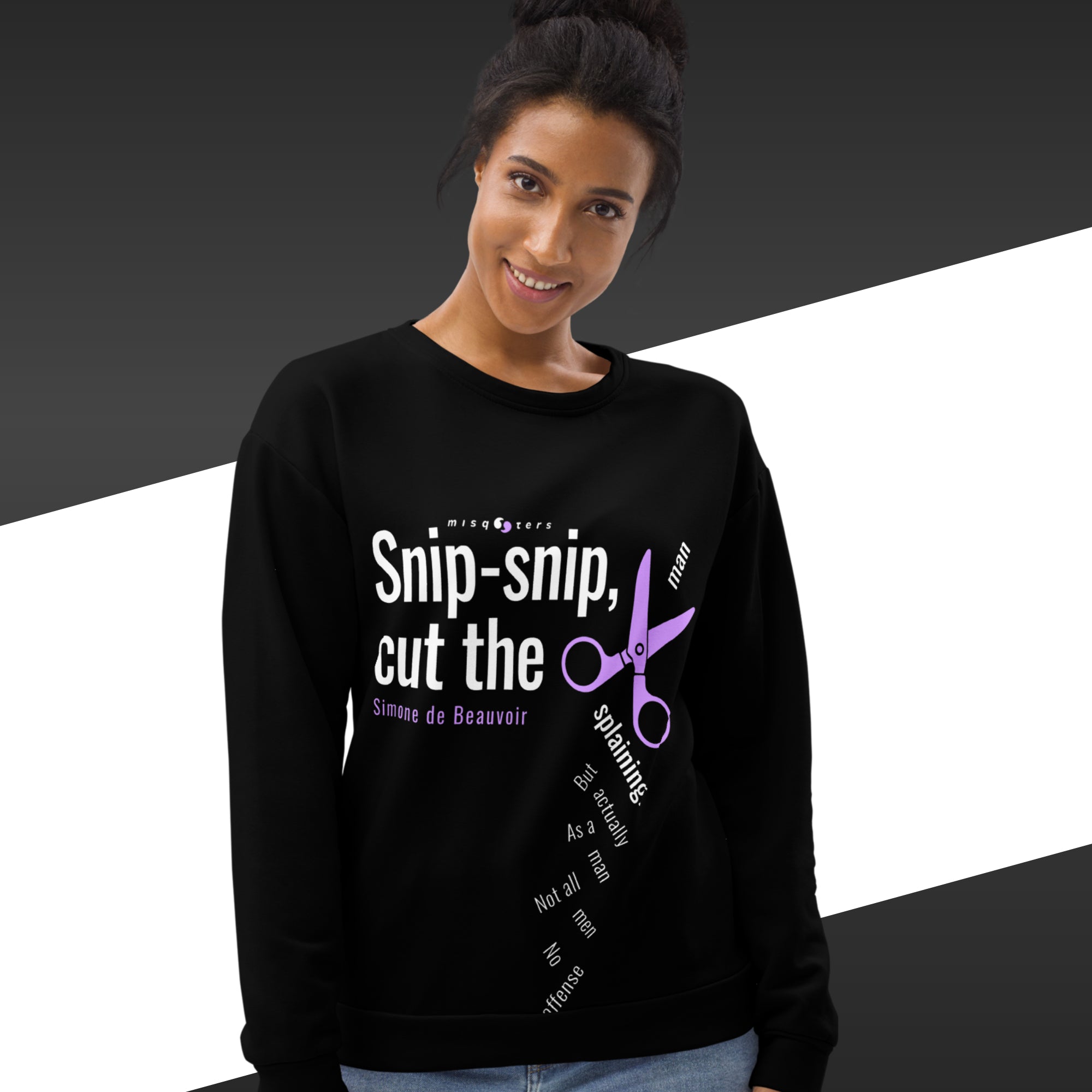 Woman wearing a black sweatshirt with text and scissors design on a black and white background