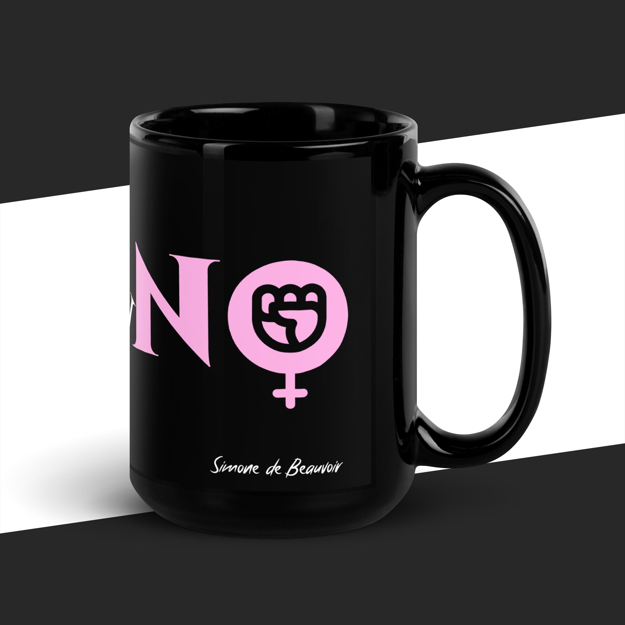 Black mug with pink graphic and text on a black and white background