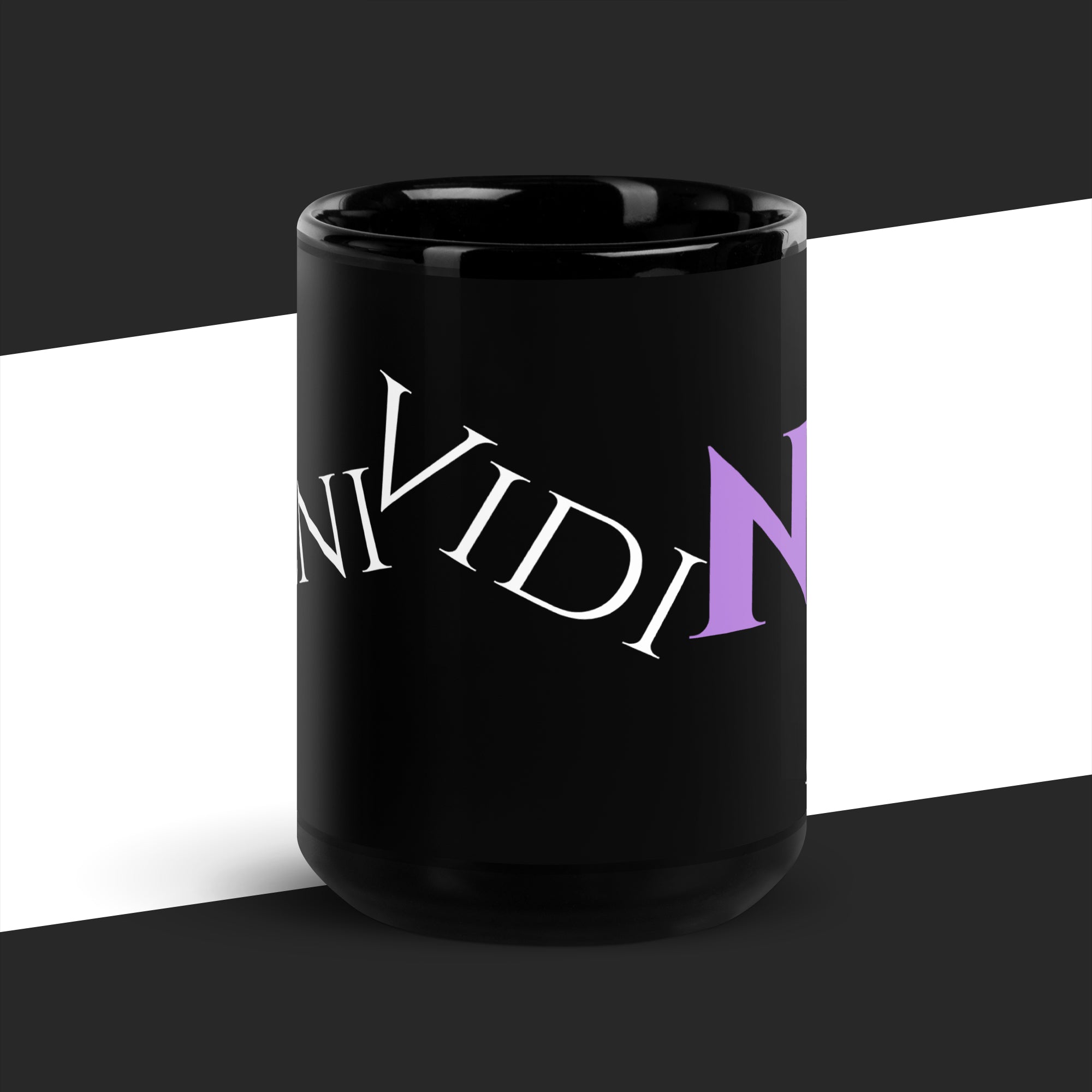 Black mug with a white and purple graphic on a black and white background