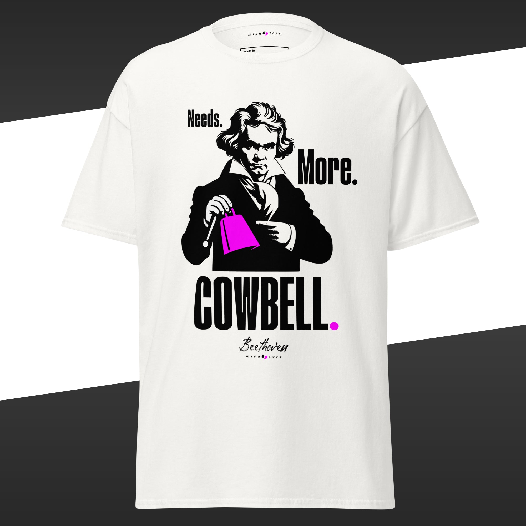 White t-shirt with a graphic of Beethoven holding a green cowbell and fake quote 'Needs More Cowbell' on a black and white background.