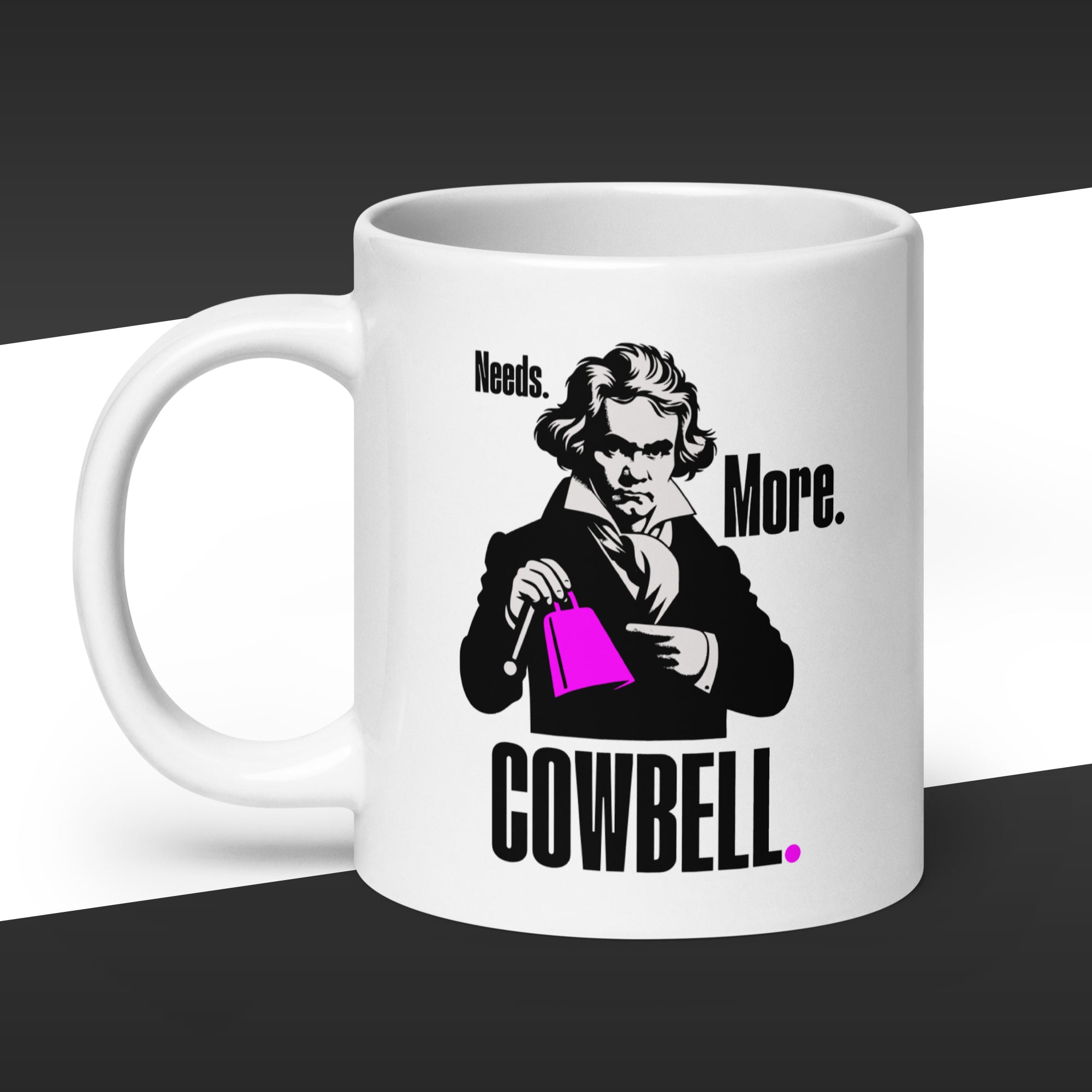 White mug with a graphic of Beethoven holding a purple cowbell and fake quote 'Needs More Cowbell'