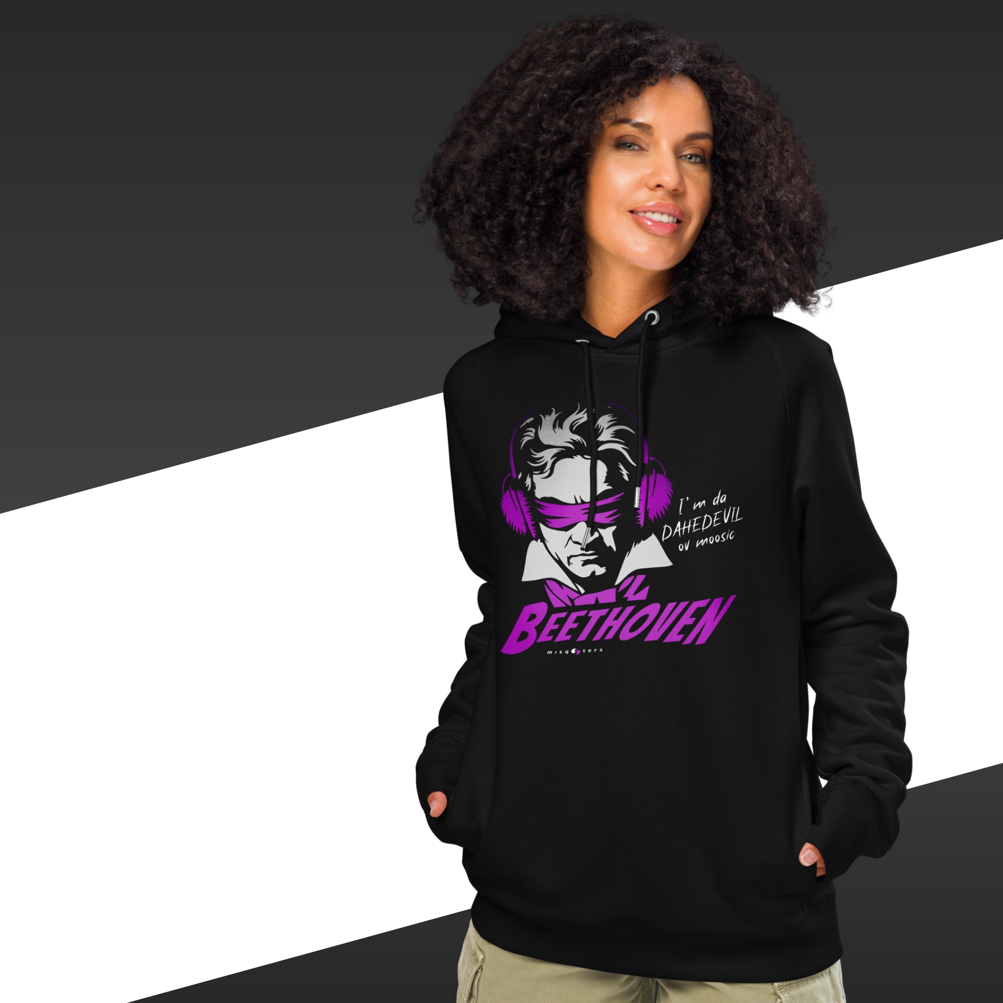 Person wearing a black hoodie with a graphic design and text, on a black and white background