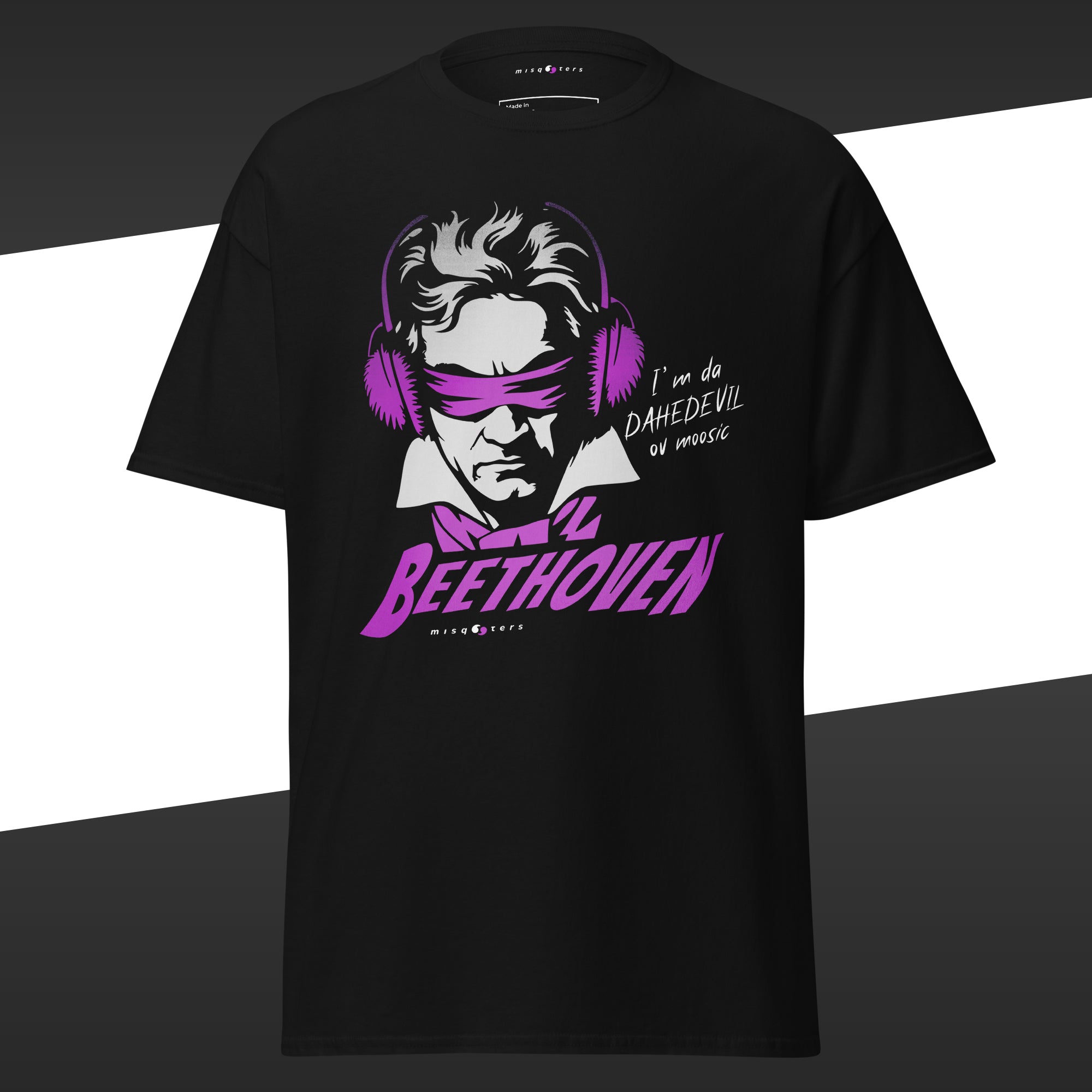 Black t-shirt with a purple and white graphic of Beethoven wearing ear protectors, is blidnfolded, and featuring the fake quote "I´m da Dahedevil ov moosic" by Beethoven