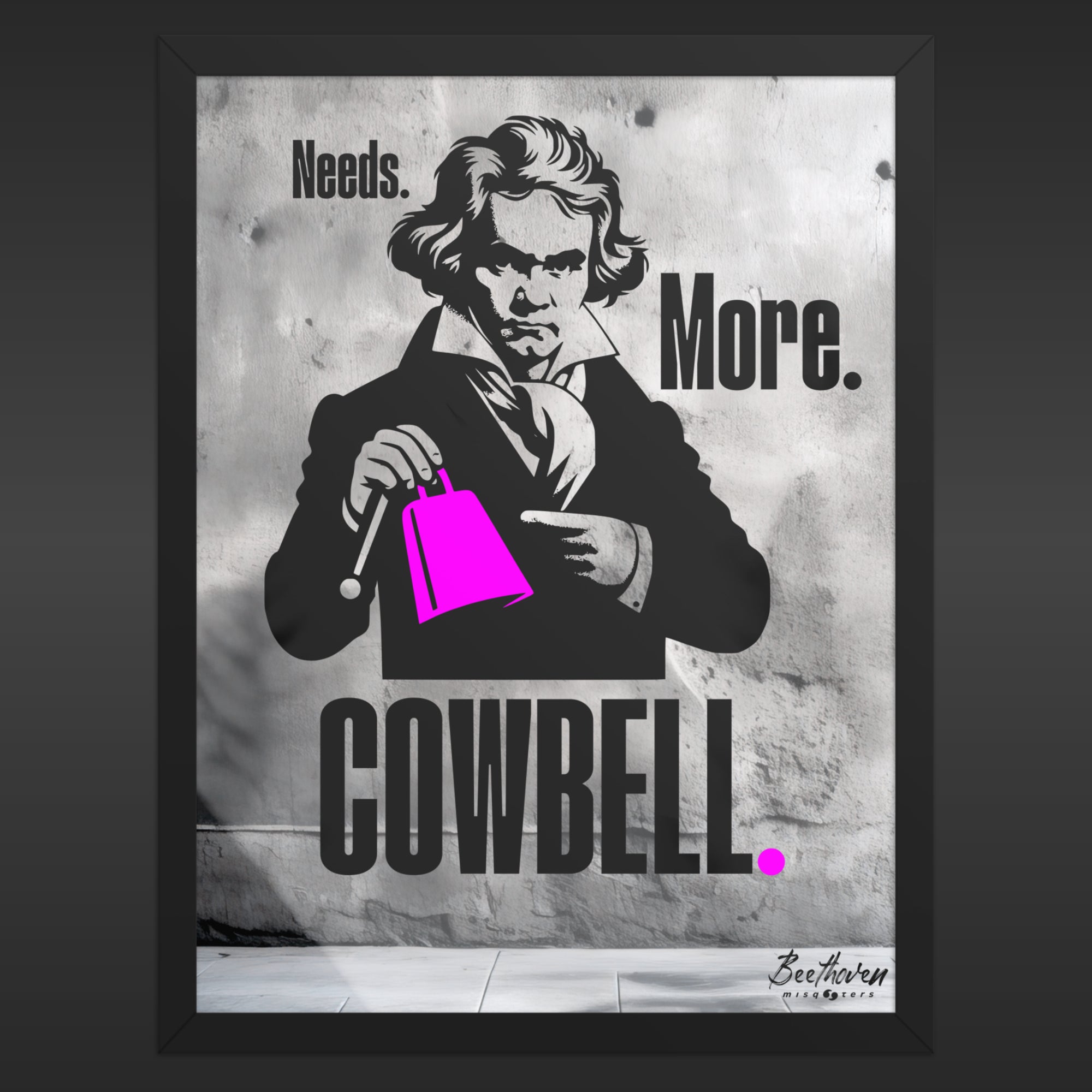 Framed poster with a black and white illustration of a person holding a pink cowbell, with text 'Needs. More. Cowbell.'