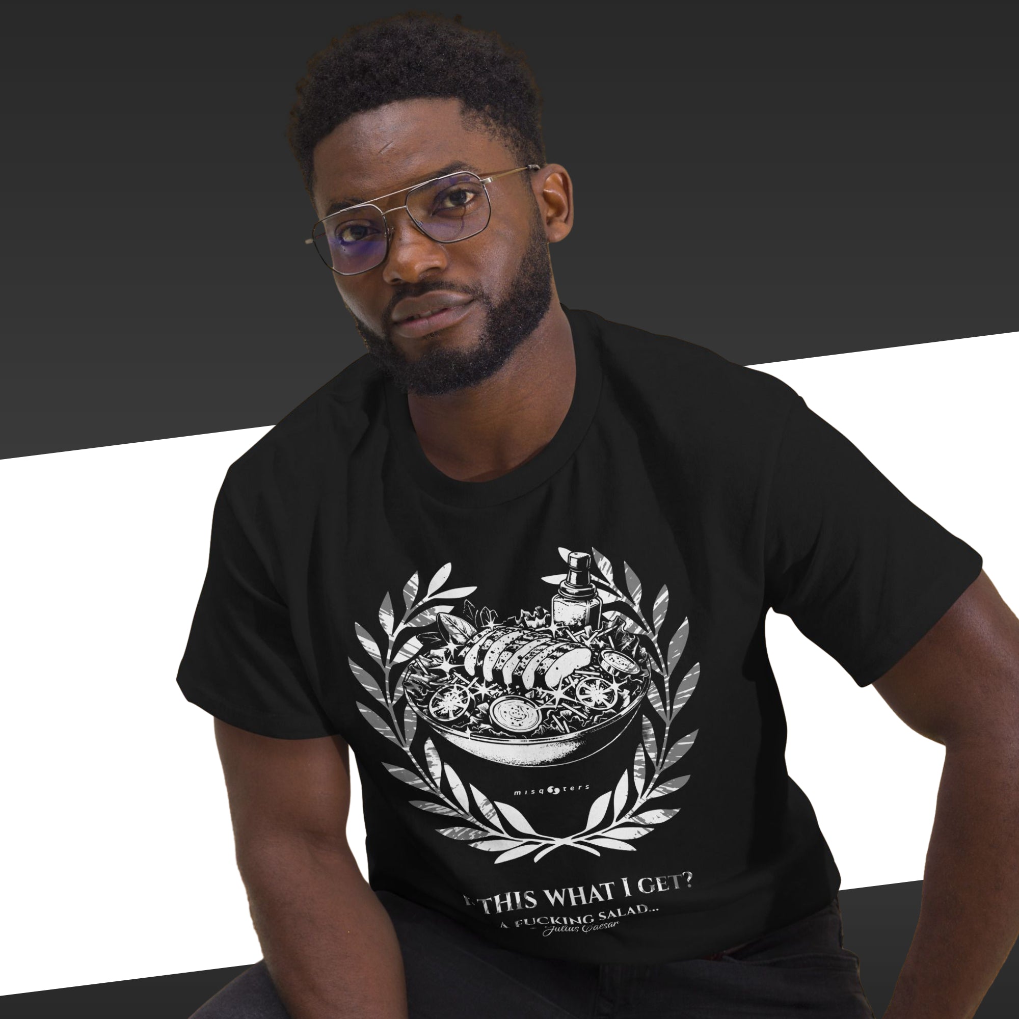 Man wearing a black t-shirt with a graphic design and text.