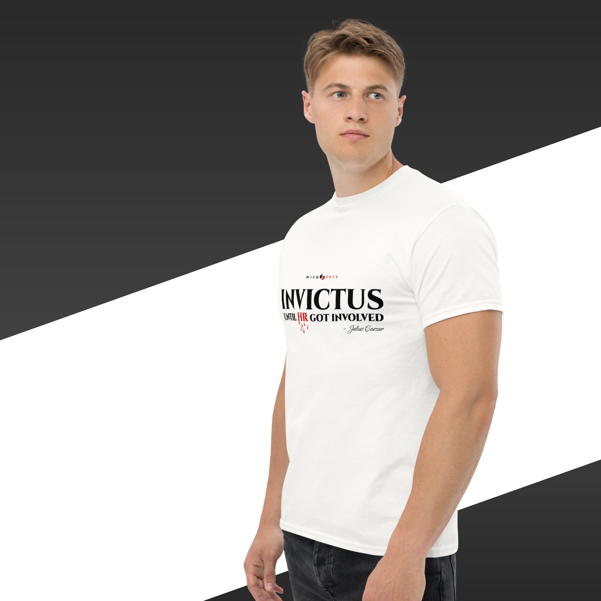 Man wearing a white t-shirt with 'Invictus' text on a black and white background