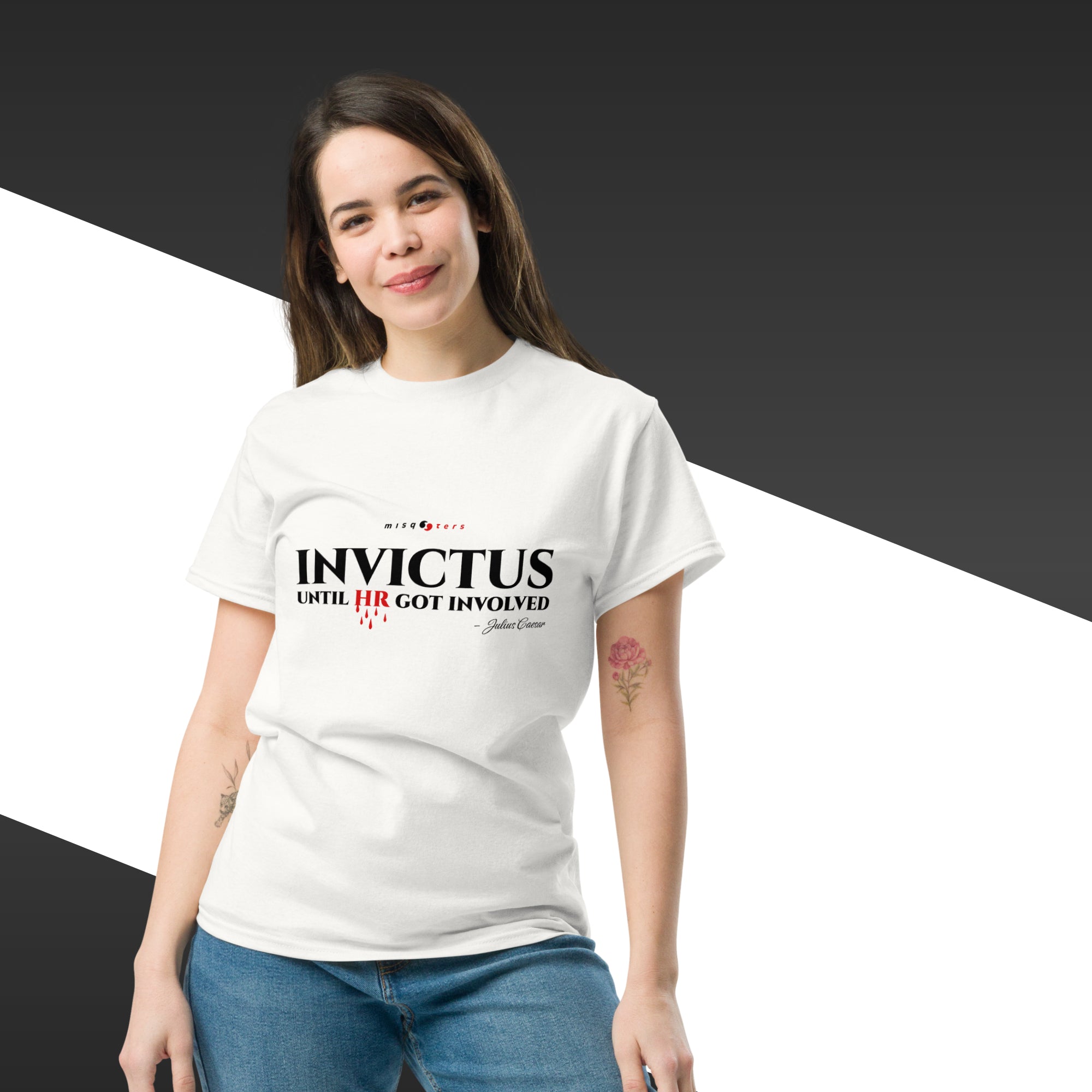 Woman wearing a white t-shirt with 'Invictus' text design on a black and white background