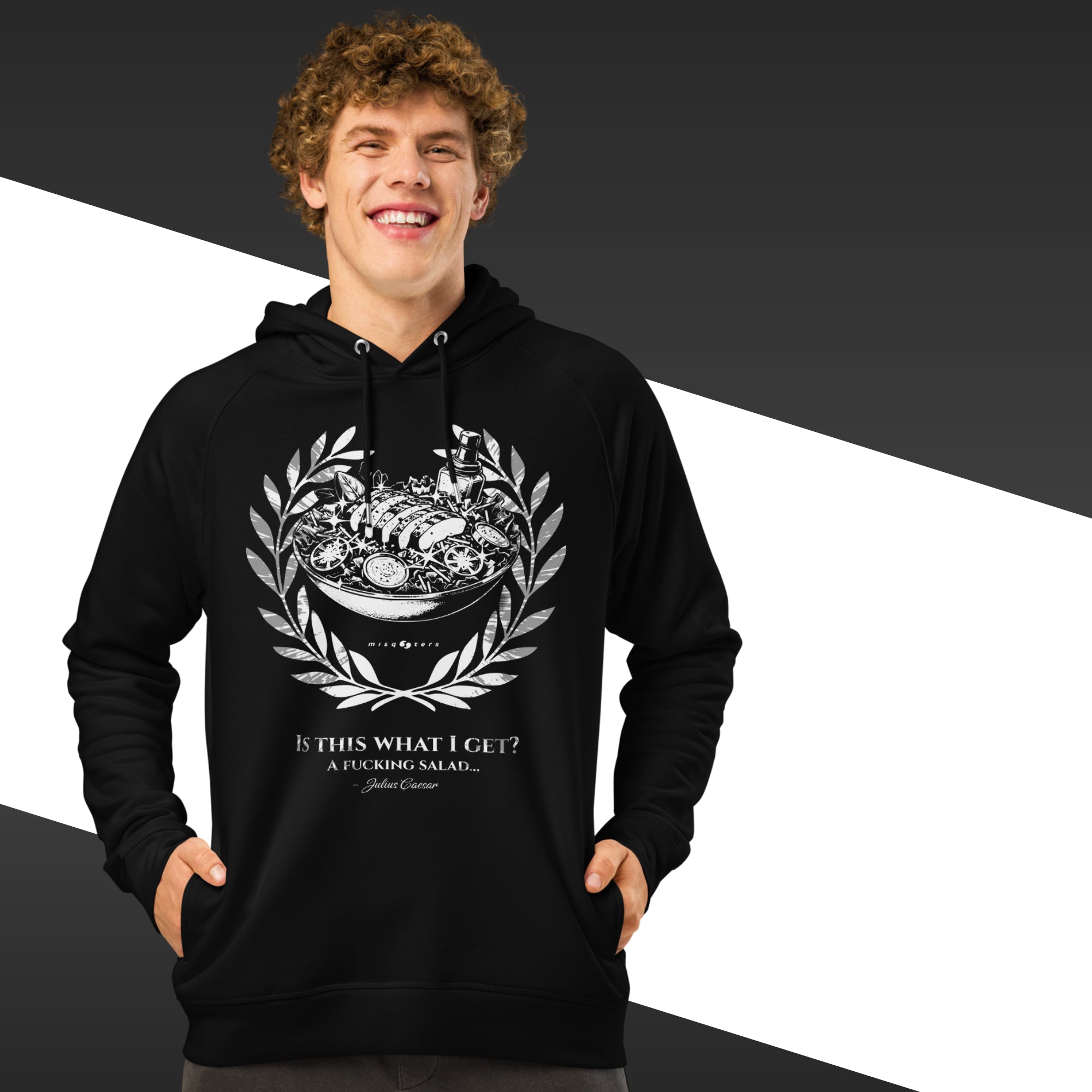 Person wearing a black hoodie with a graphic design and text on a black and white background