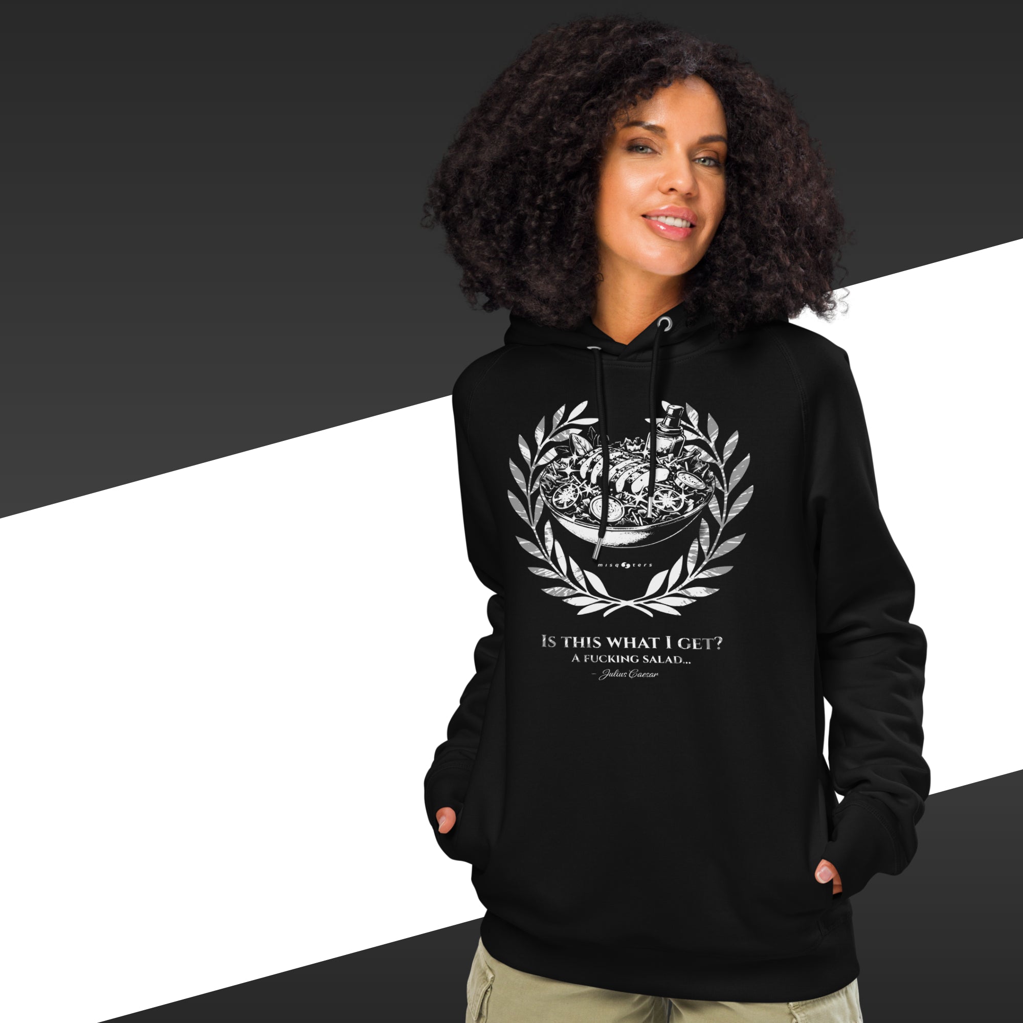 Person wearing a black hoodie with a graphic design and text on a black and white background