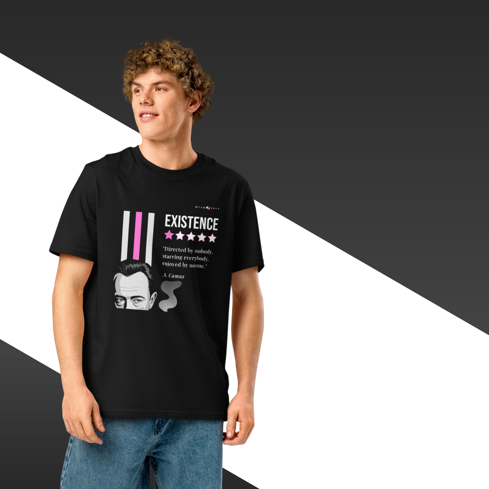 Man wearing a black t-shirt with a white and magenta graphic of Albert Camus and a quote