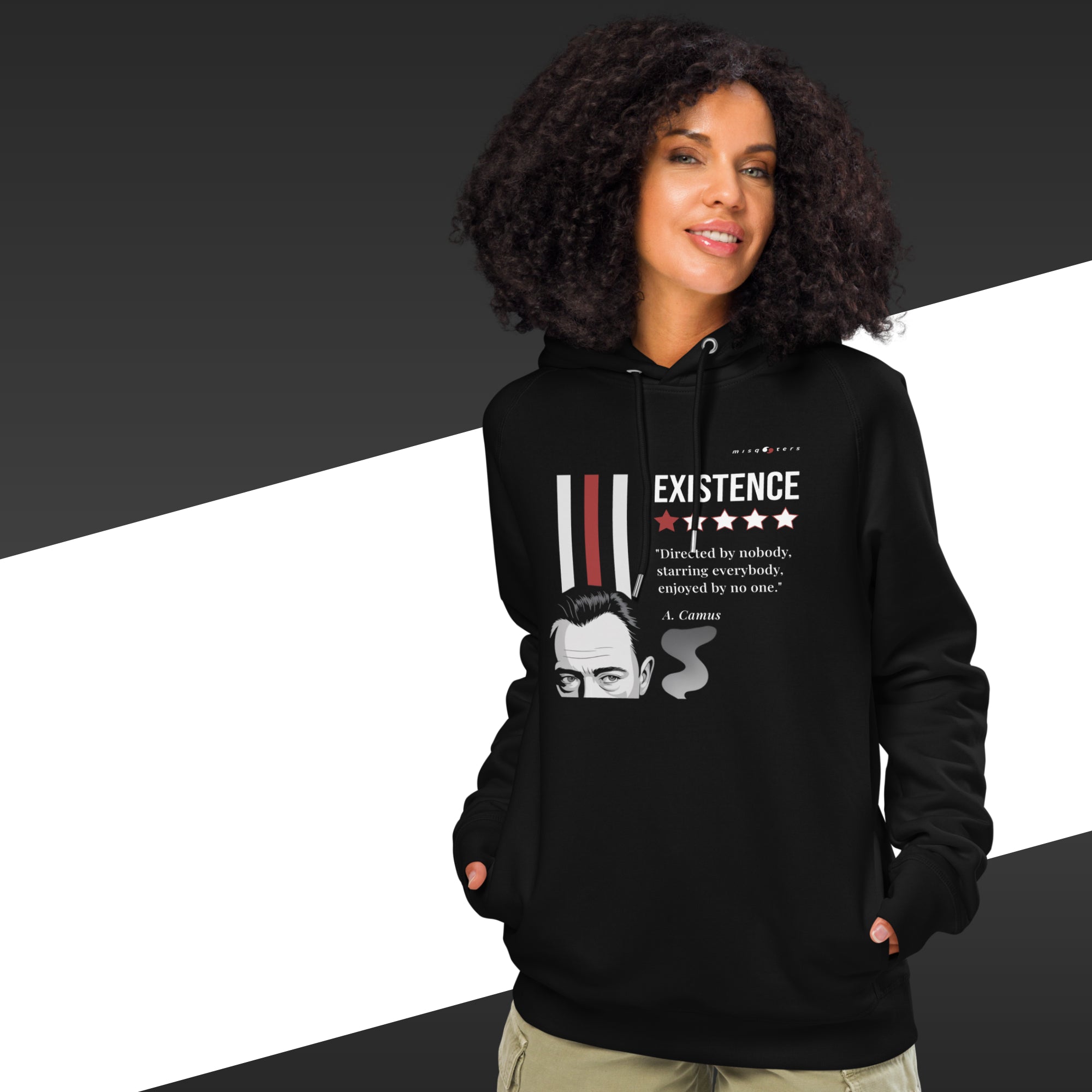 Person wearing a black hoodie with a design and text, standing against a black and white background.
