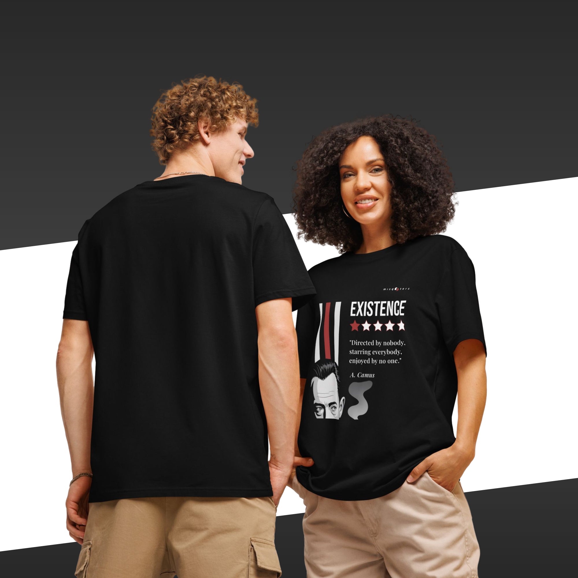 A couple wearing a black t-shirts with a white and yellow graphic of Albert Camus and a quote