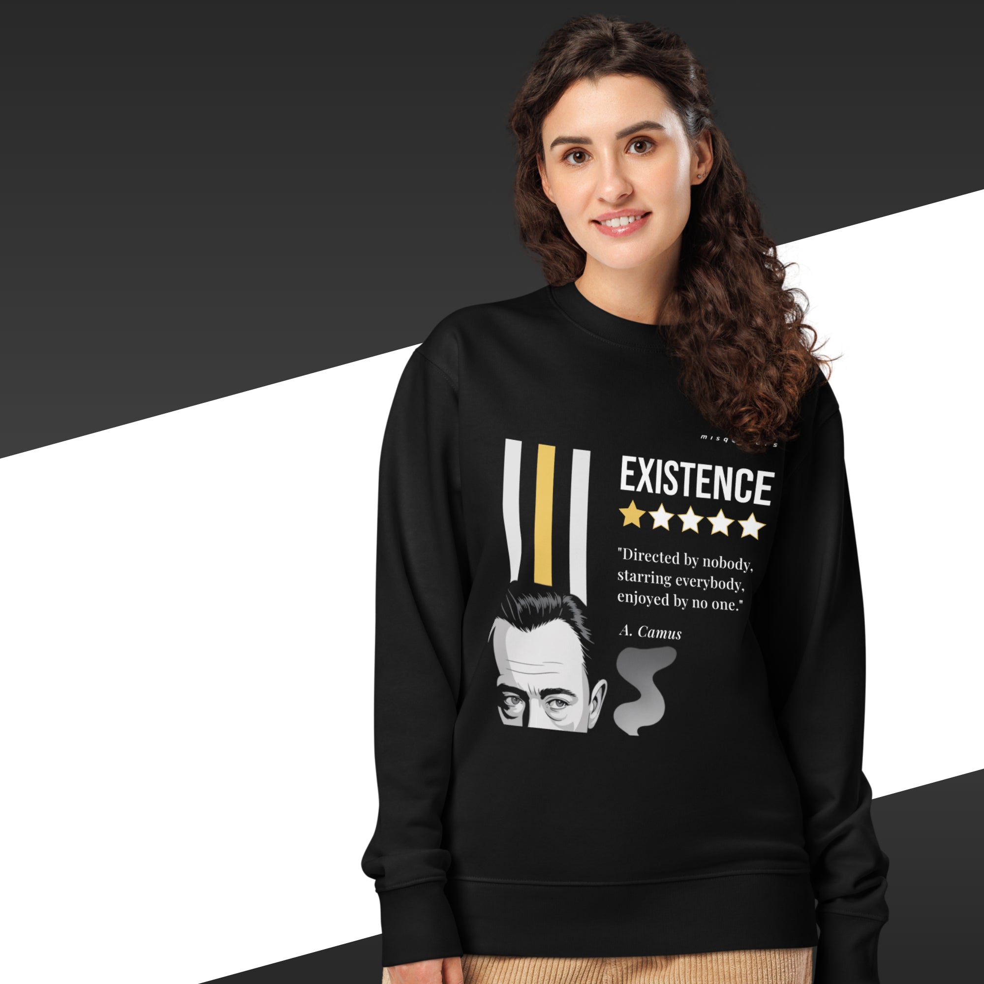 Person wearing a black sweatshirt with a graphic design and text on a black and white background
