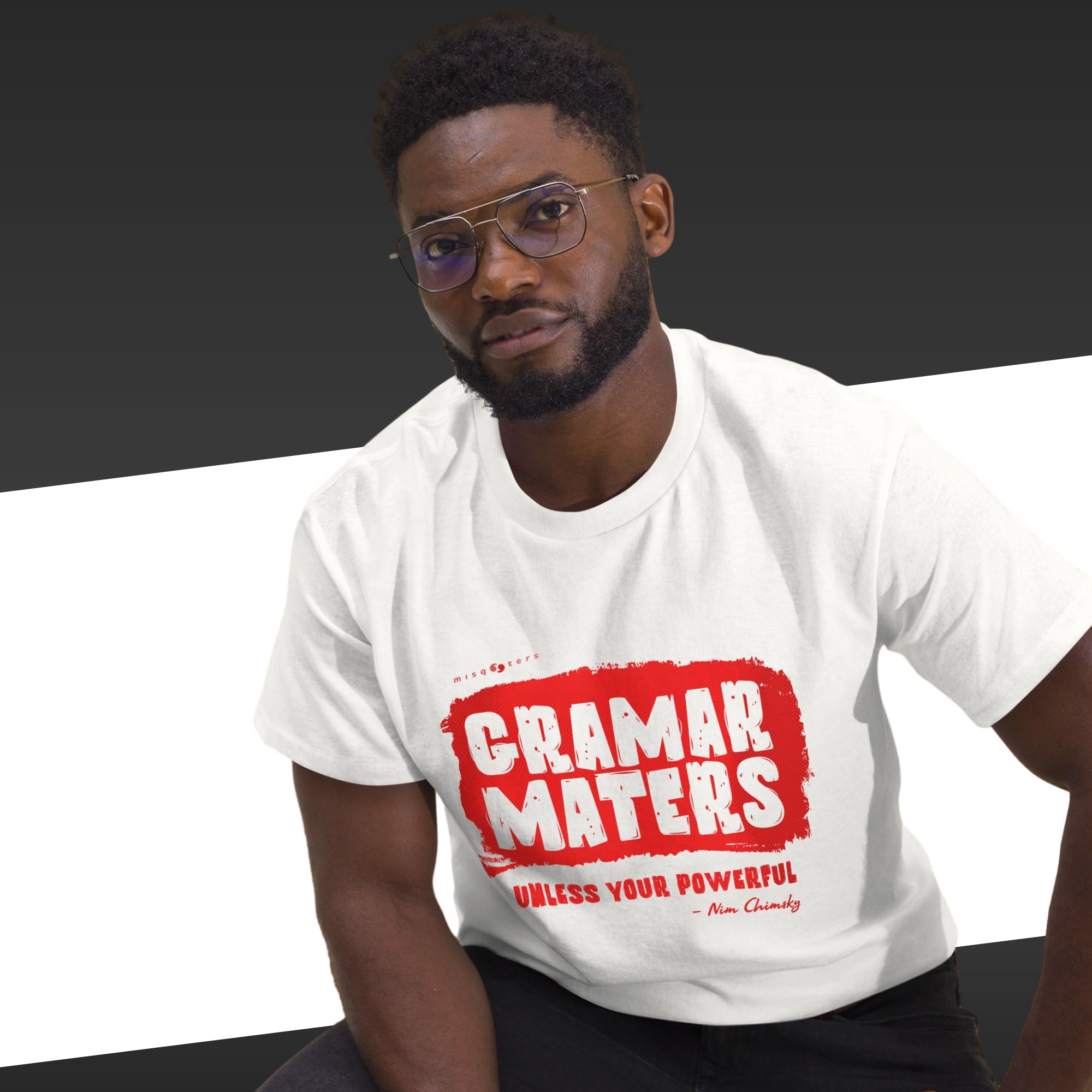 Man wearing a white t-shirt with red text on a black background