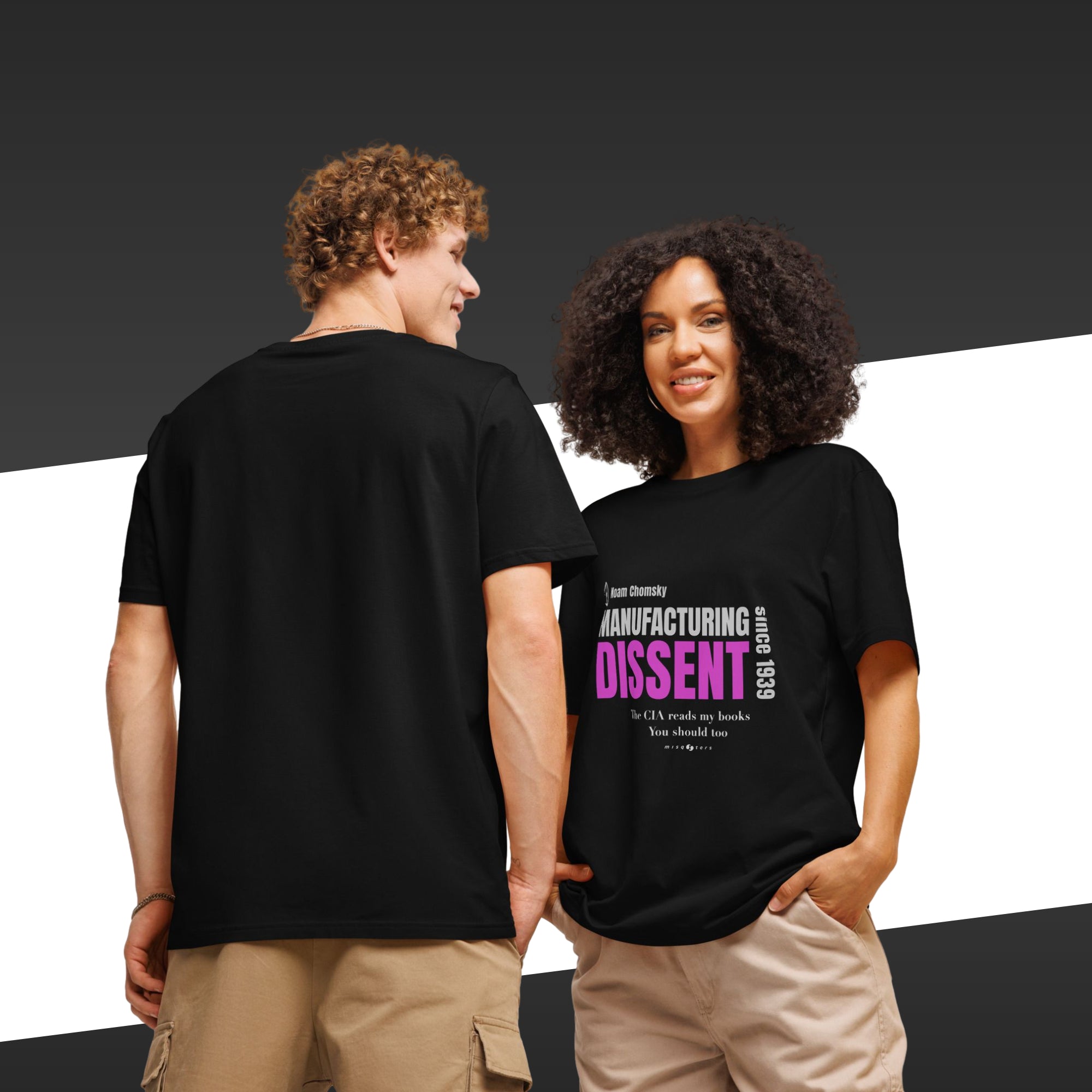 Two people wearing black t-shirts with text, one facing away from the camera.