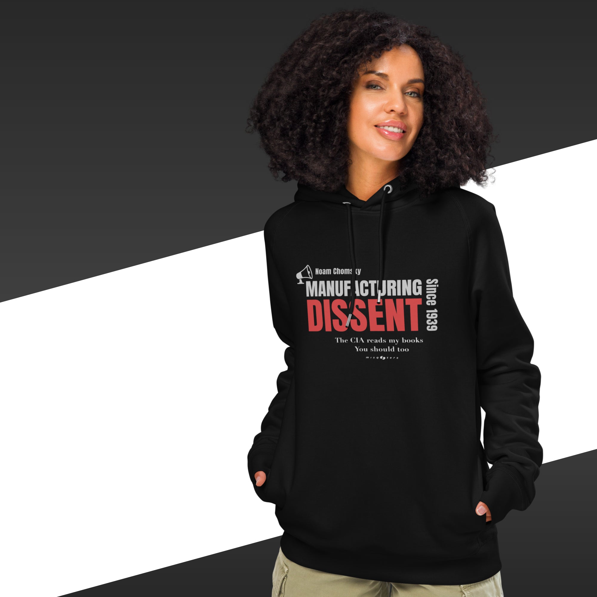 Woman with black hoodie featuring the fake quote "manufacturing dissent" by Noam Chomsky in white and red.