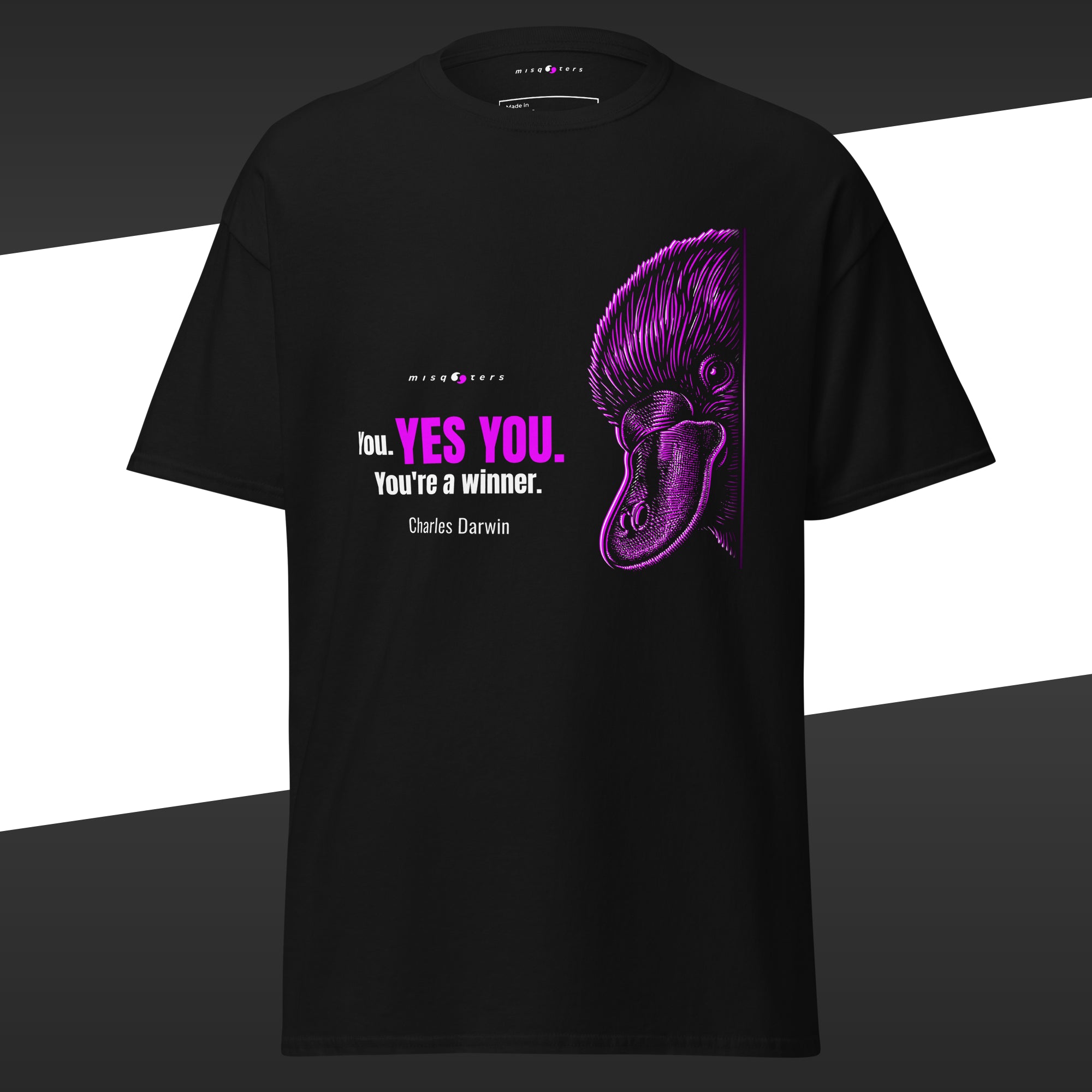 Black t-shirt with purple duck graphic and text on a white and black striped background