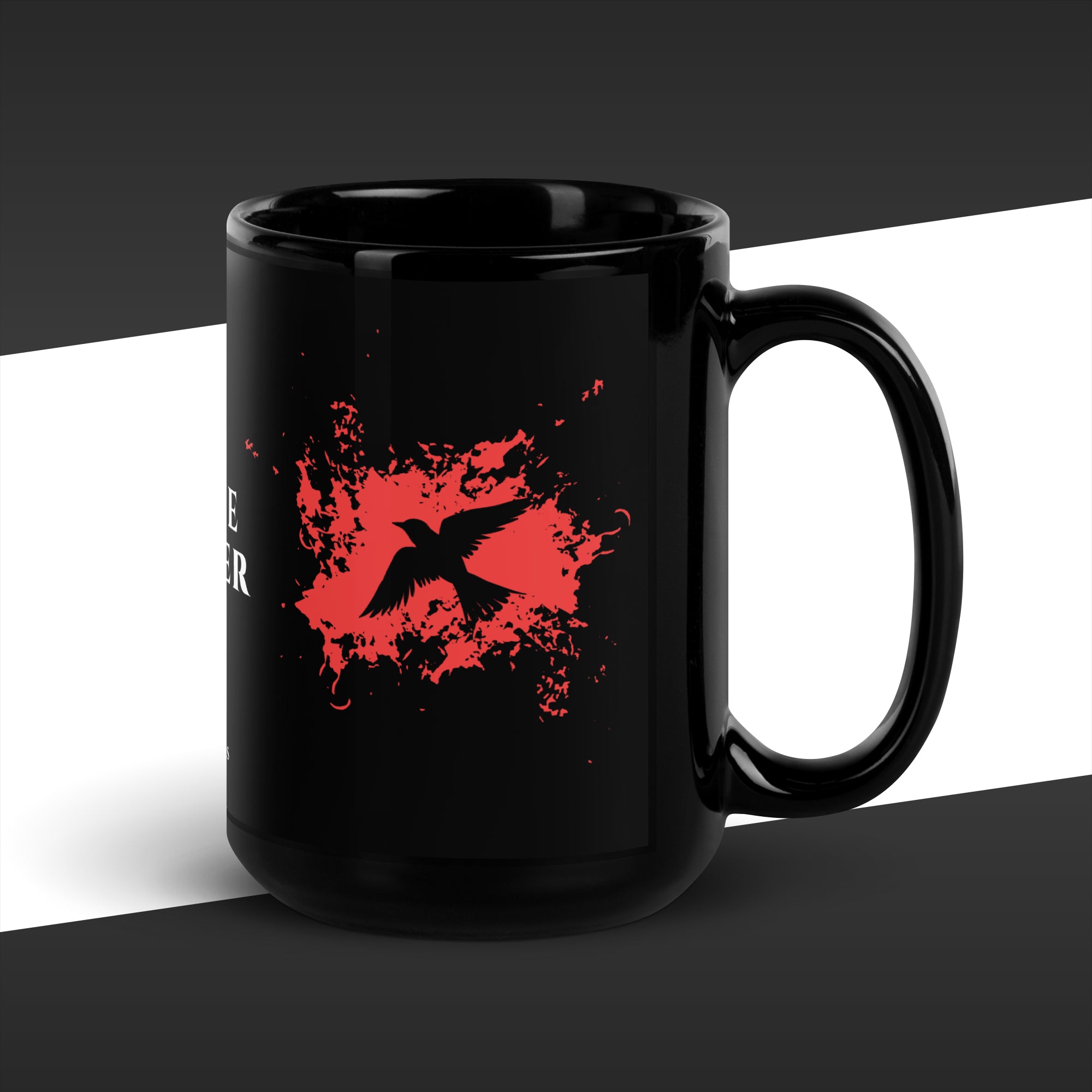 Black mug with red graphic design on a black and white background