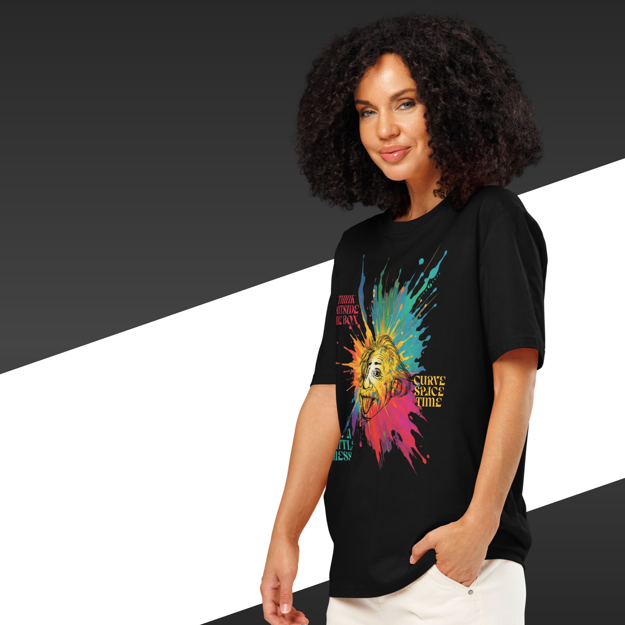 Woman wearing a black t-shirt with a colorful graphic design on a black and white background