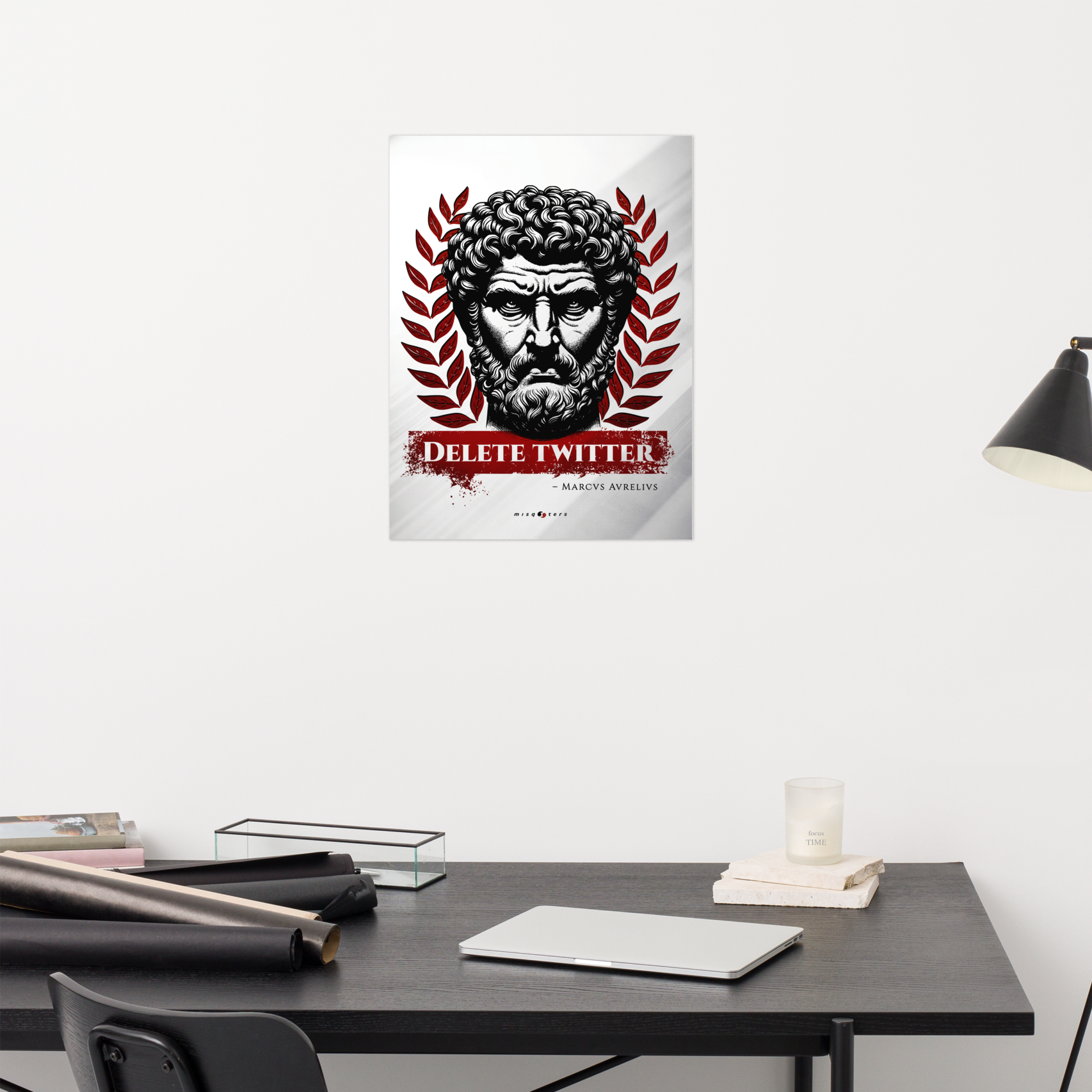 Poster with a classical design on a wall above a desk.
