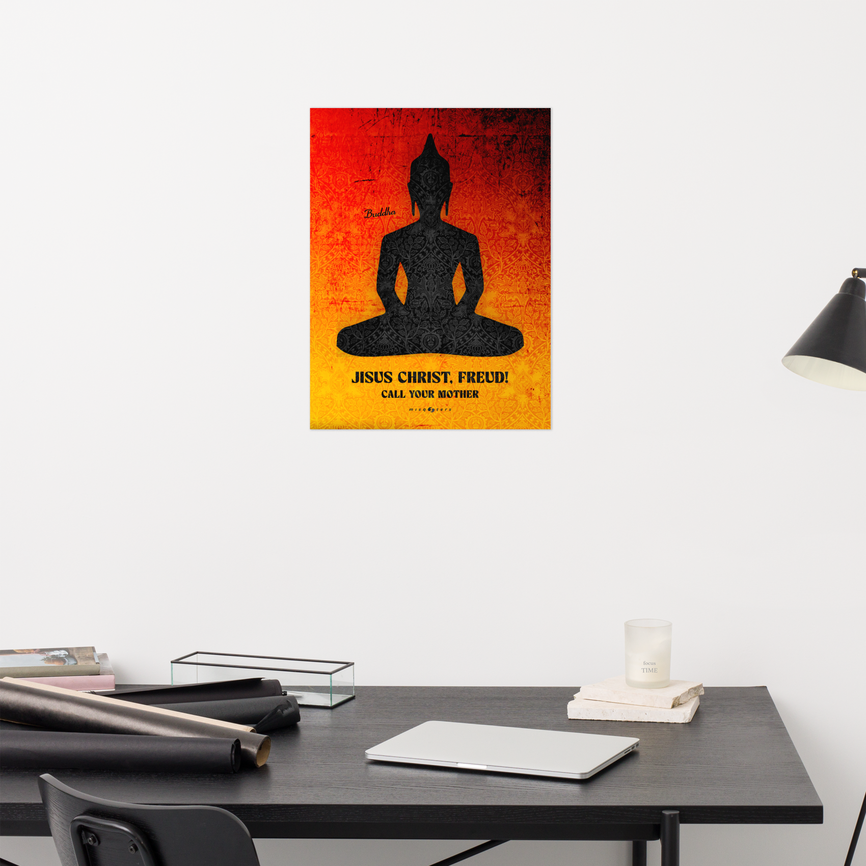 Poster of a Buddha silhouette with text on a wall above a desk.