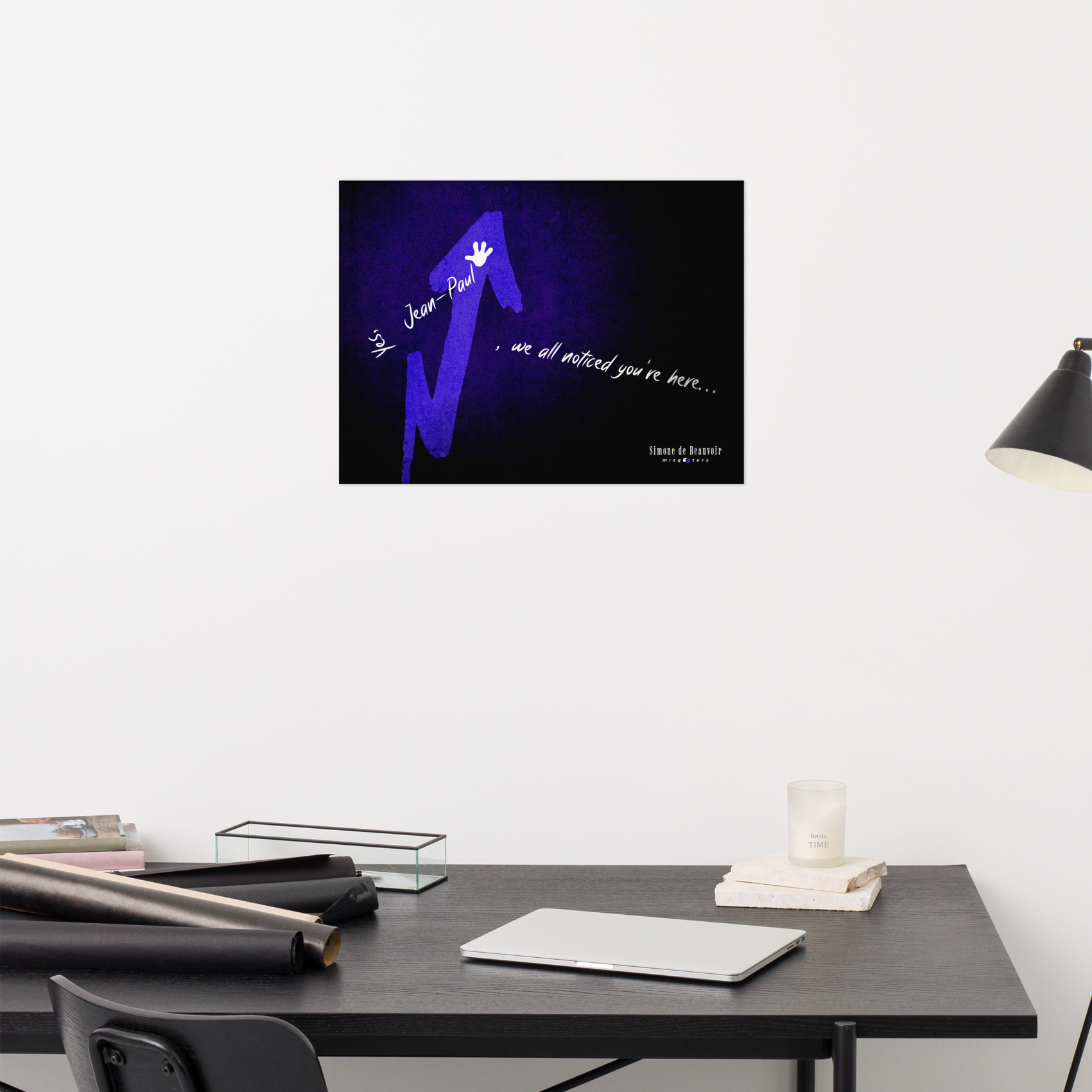 Modern office desk with a framed artwork on the wall