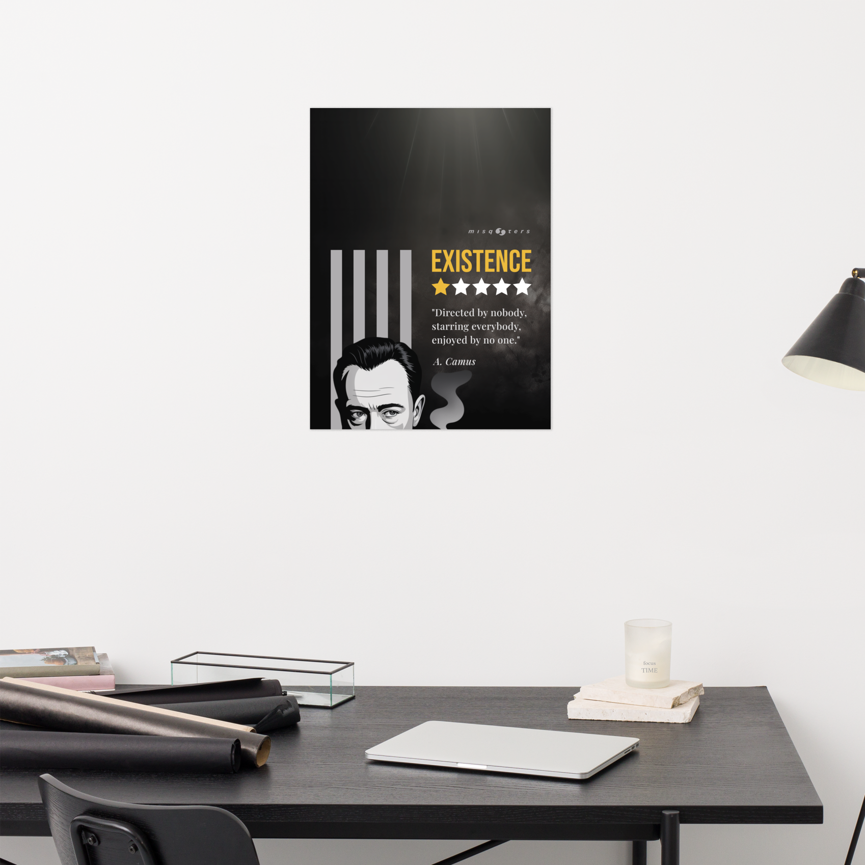 Poster with a quote on a wall above a desk