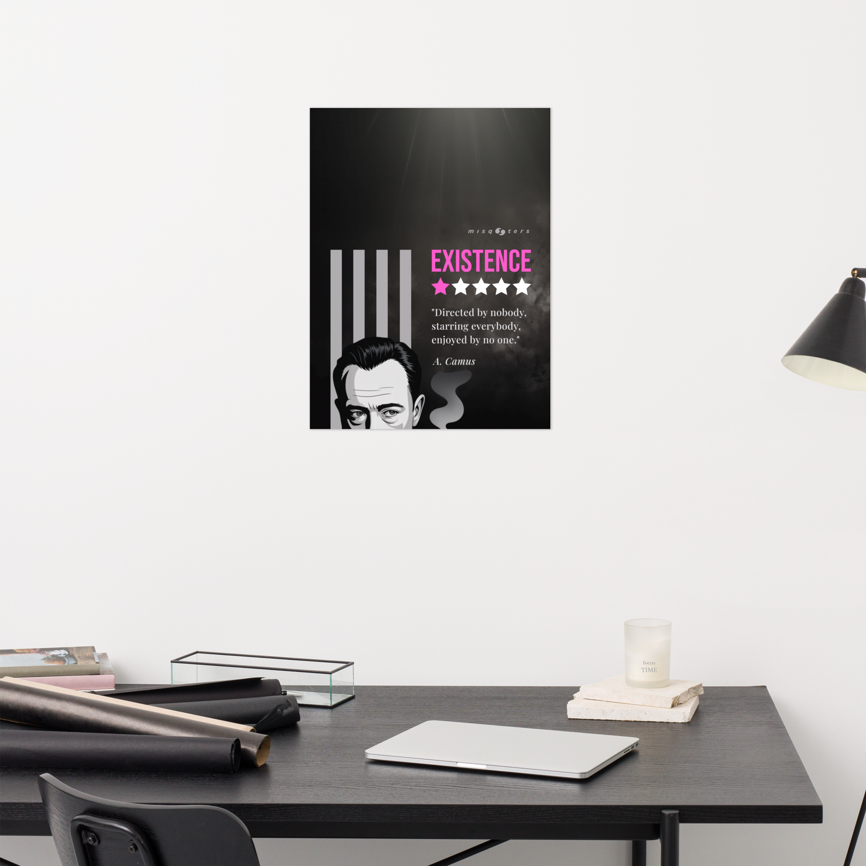 Poster with a quote on a wall above a desk