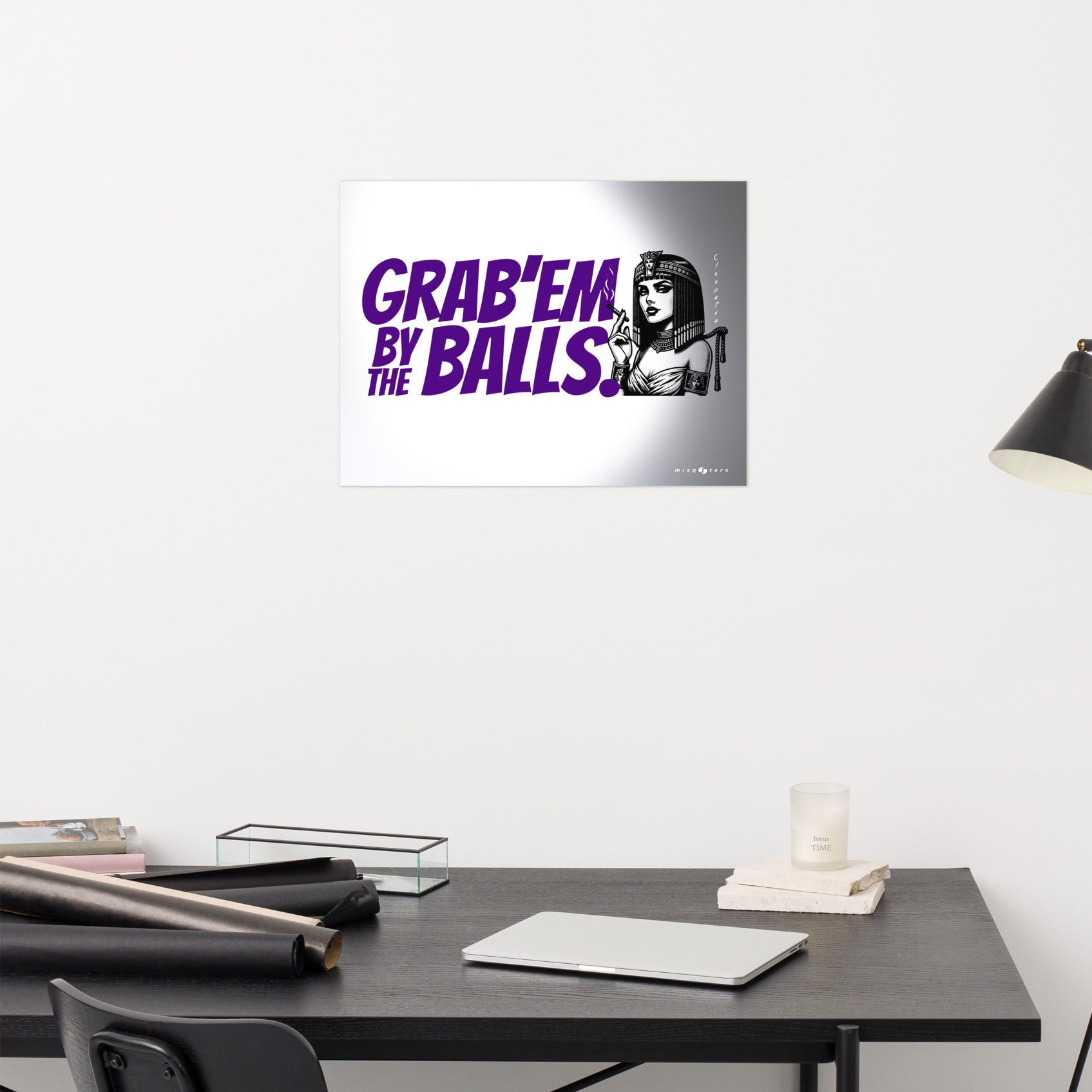 Wall art with a graphic design and text on a white wall above a desk.