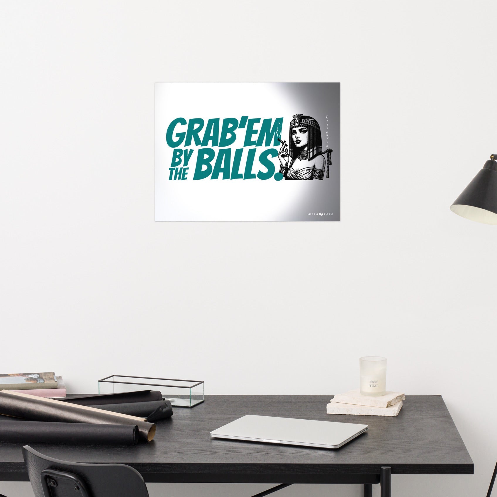 Wall art with text and a graphic of a woman on a white wall above a desk.