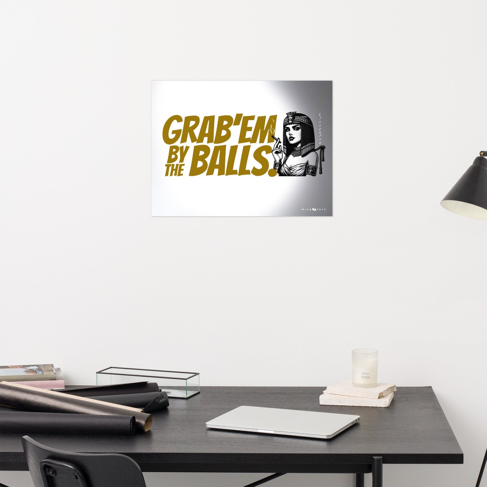 Poster with text and graphic on a wall above a desk.