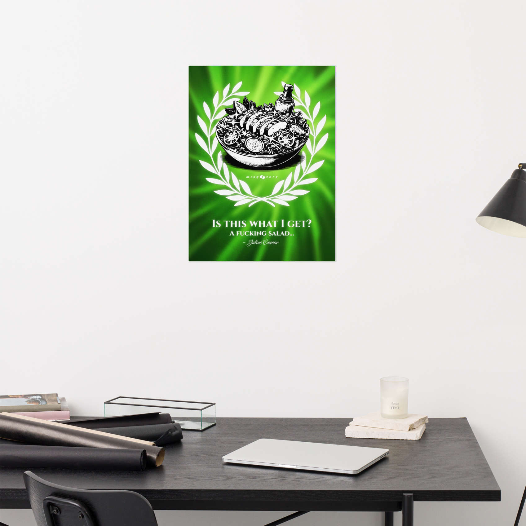 Poster with a green background and text on a wall above a desk.