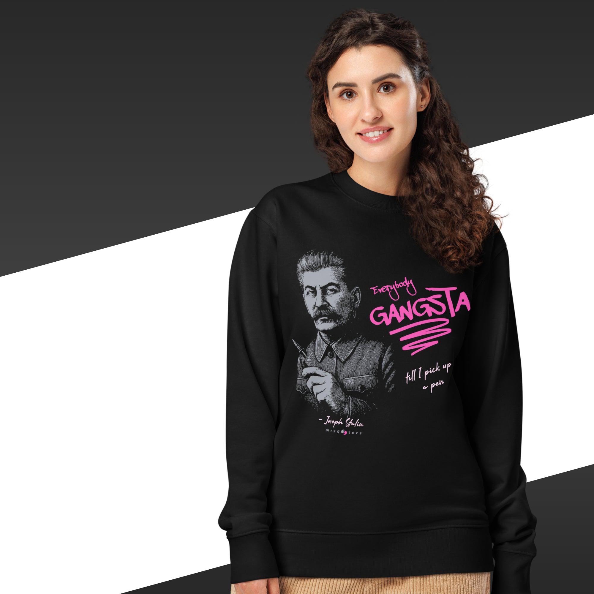 Woman wearing a black sweatshirt with a graphic and text design on a black and white background