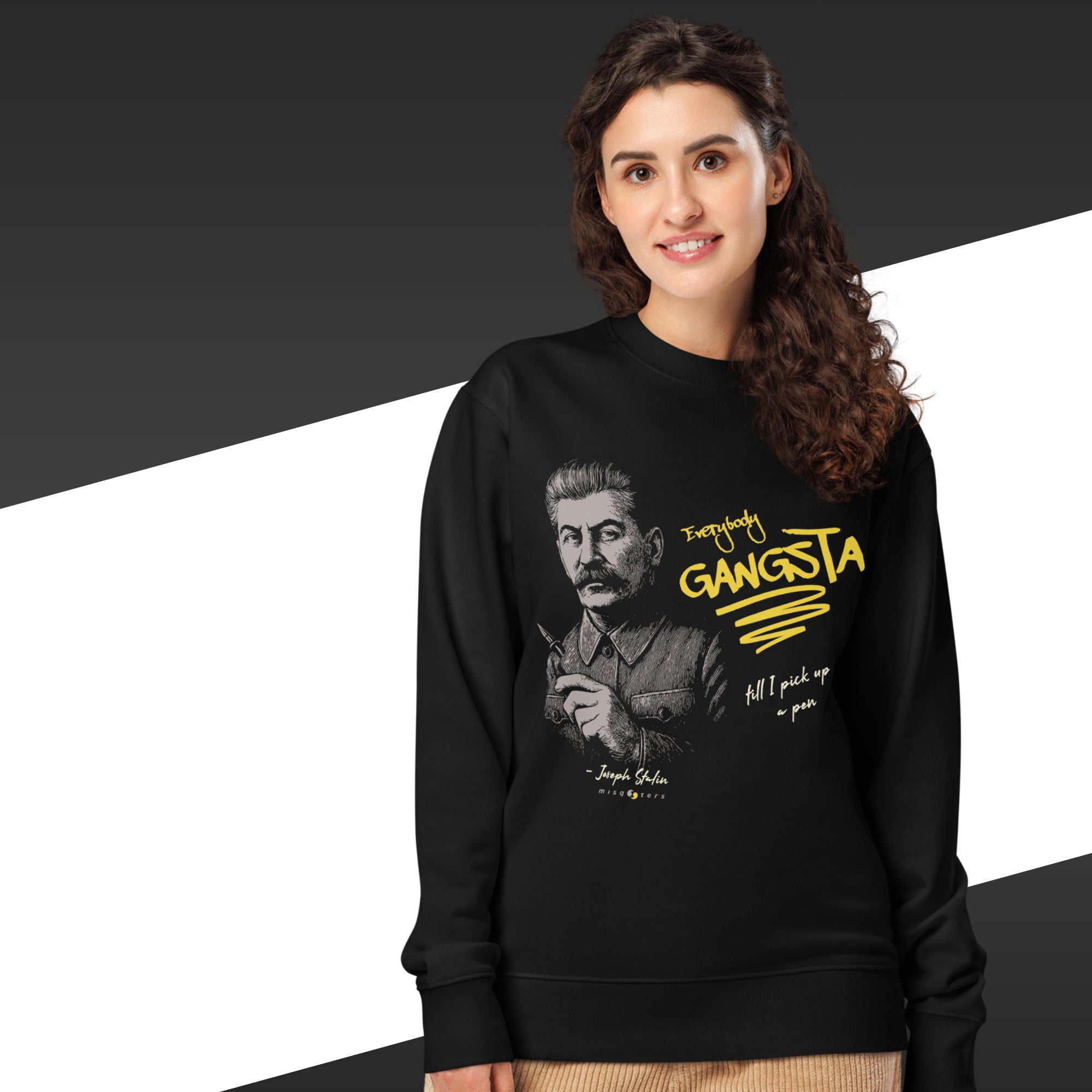 Woman wearing a black sweatshirt with a graphic and text design on a black and white background