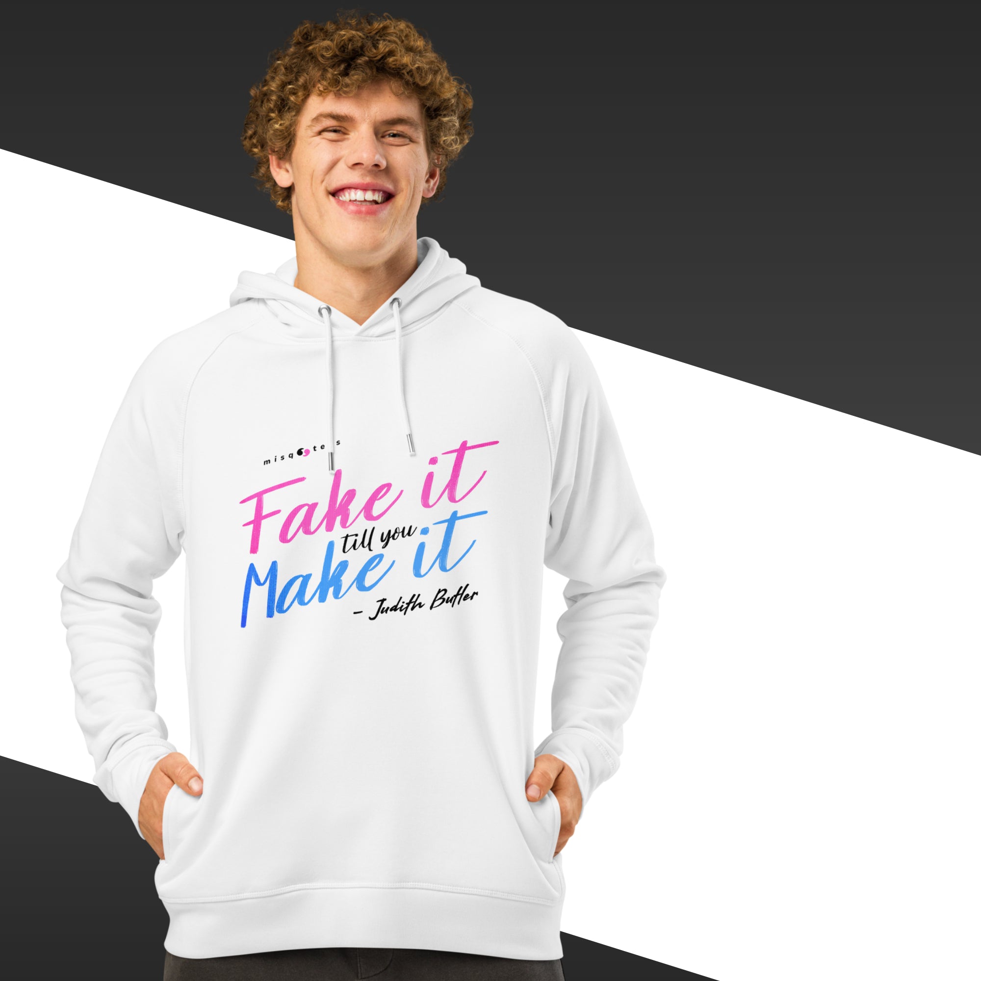 Person wearing a white hoodie with colorful text design on a black and white background