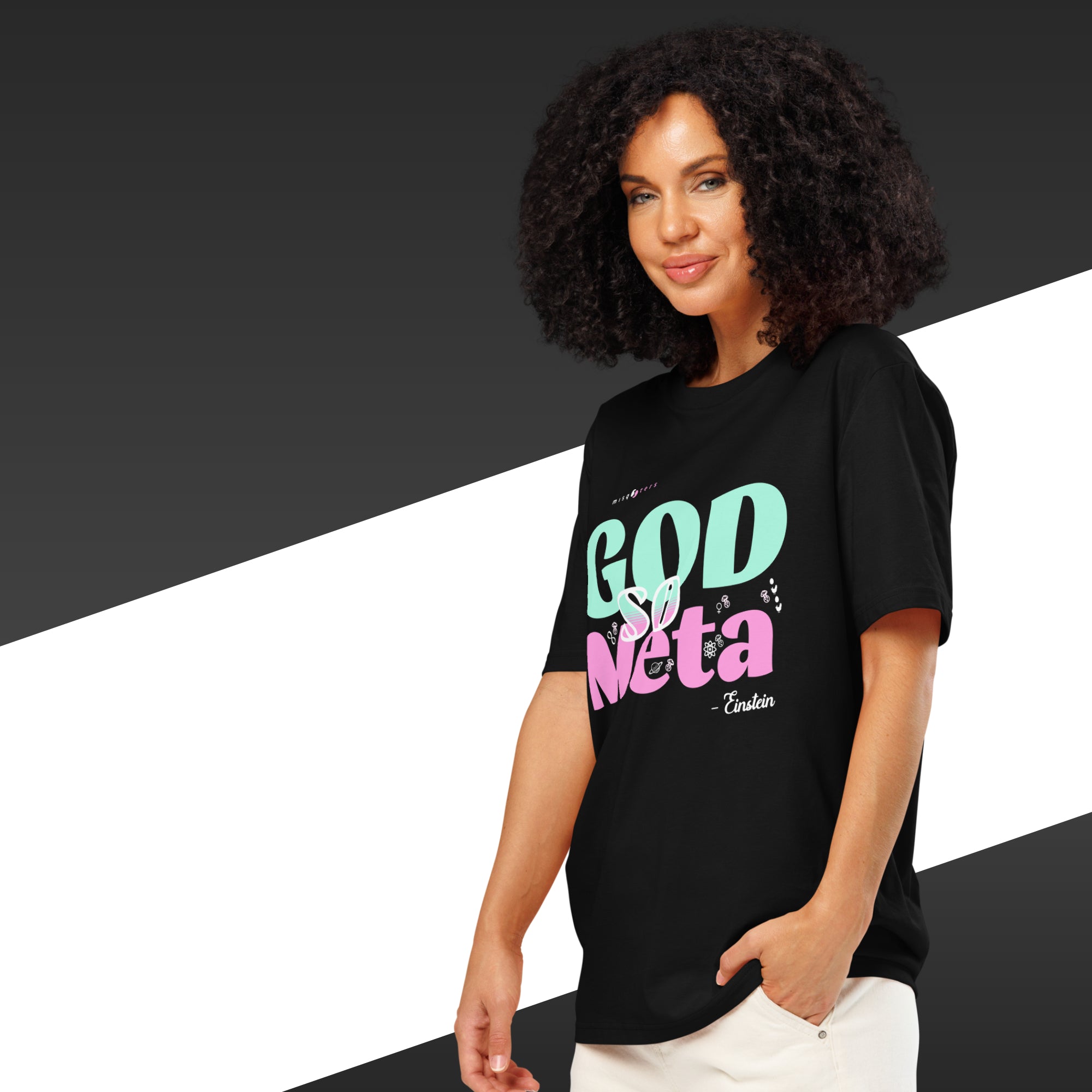 Woman wearing a black t-shirt with colorful text on a black and white background