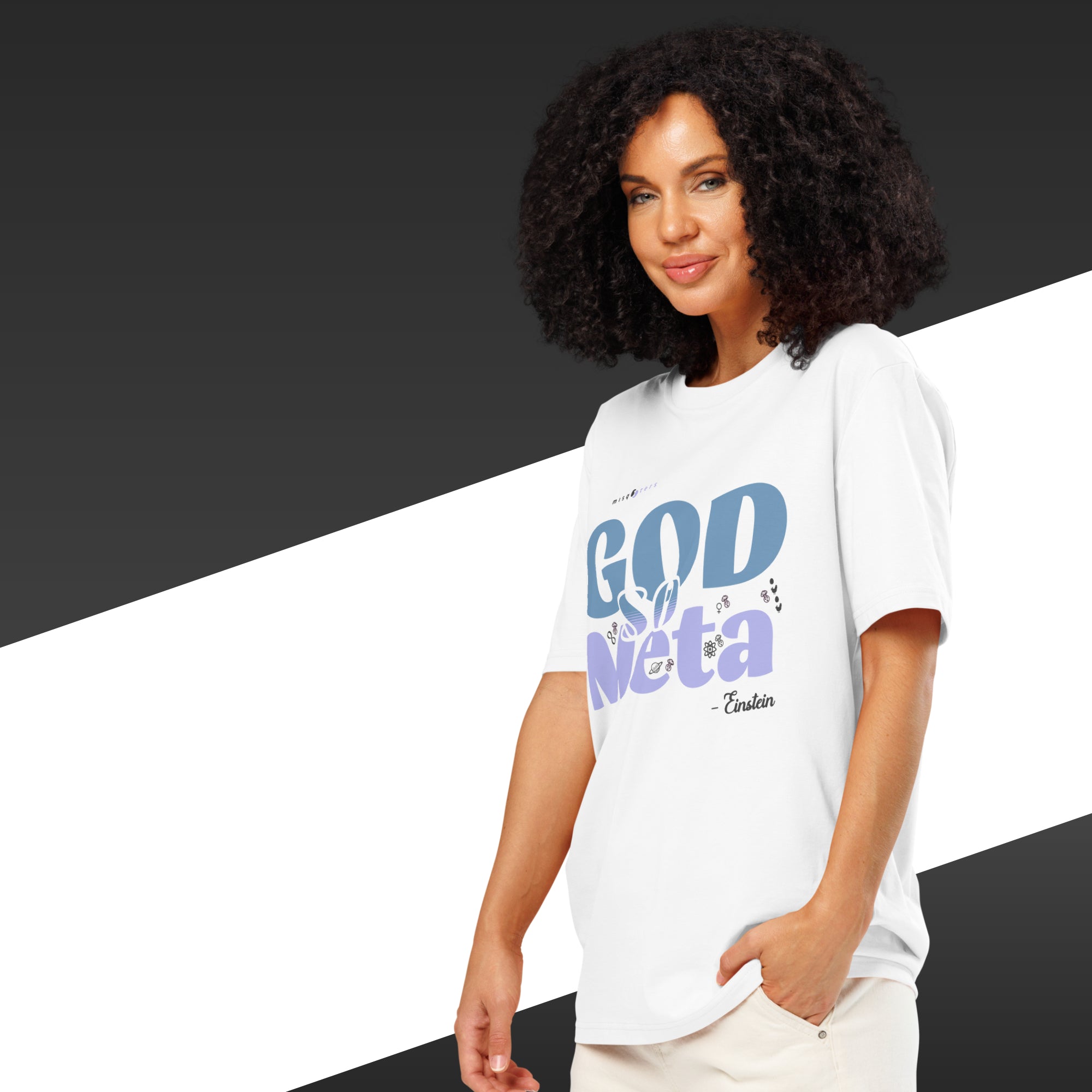 Woman wearing a white t-shirt with colorful text on a black and white background