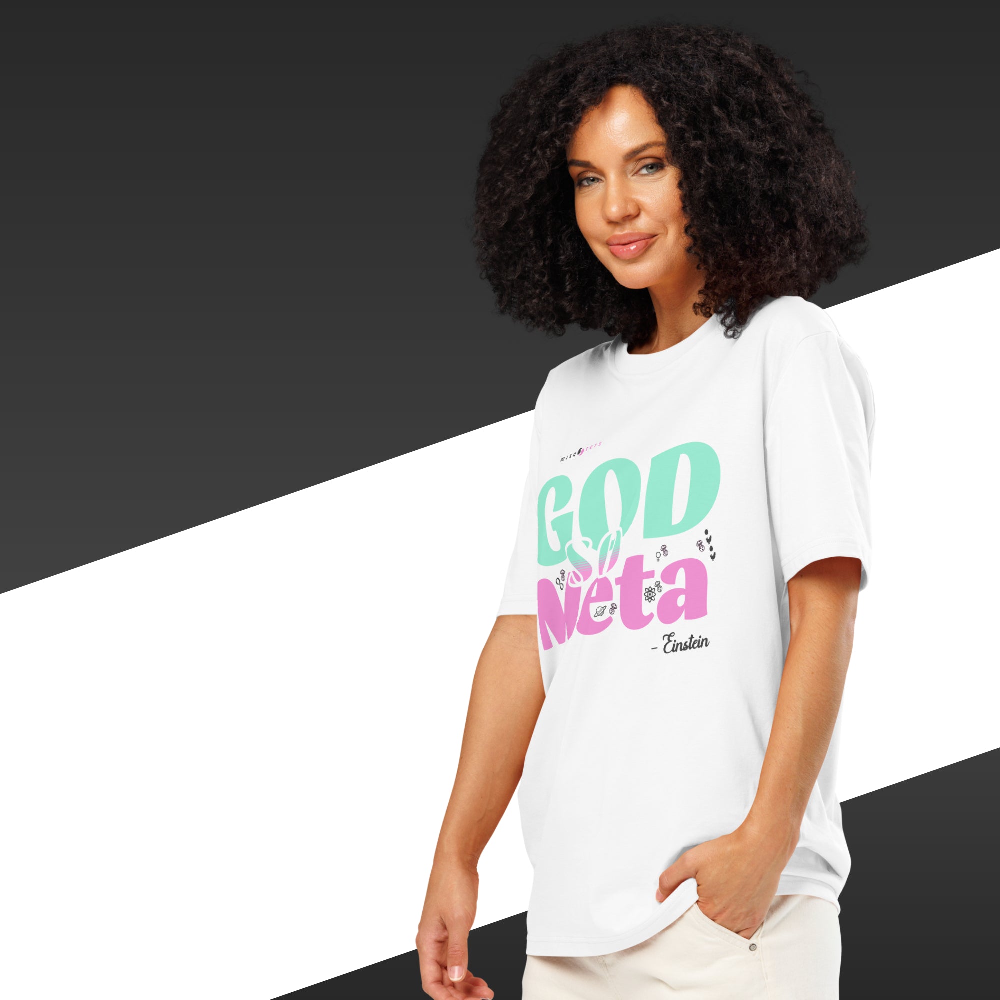 Woman wearing a white t-shirt with colorful text on a black and white background