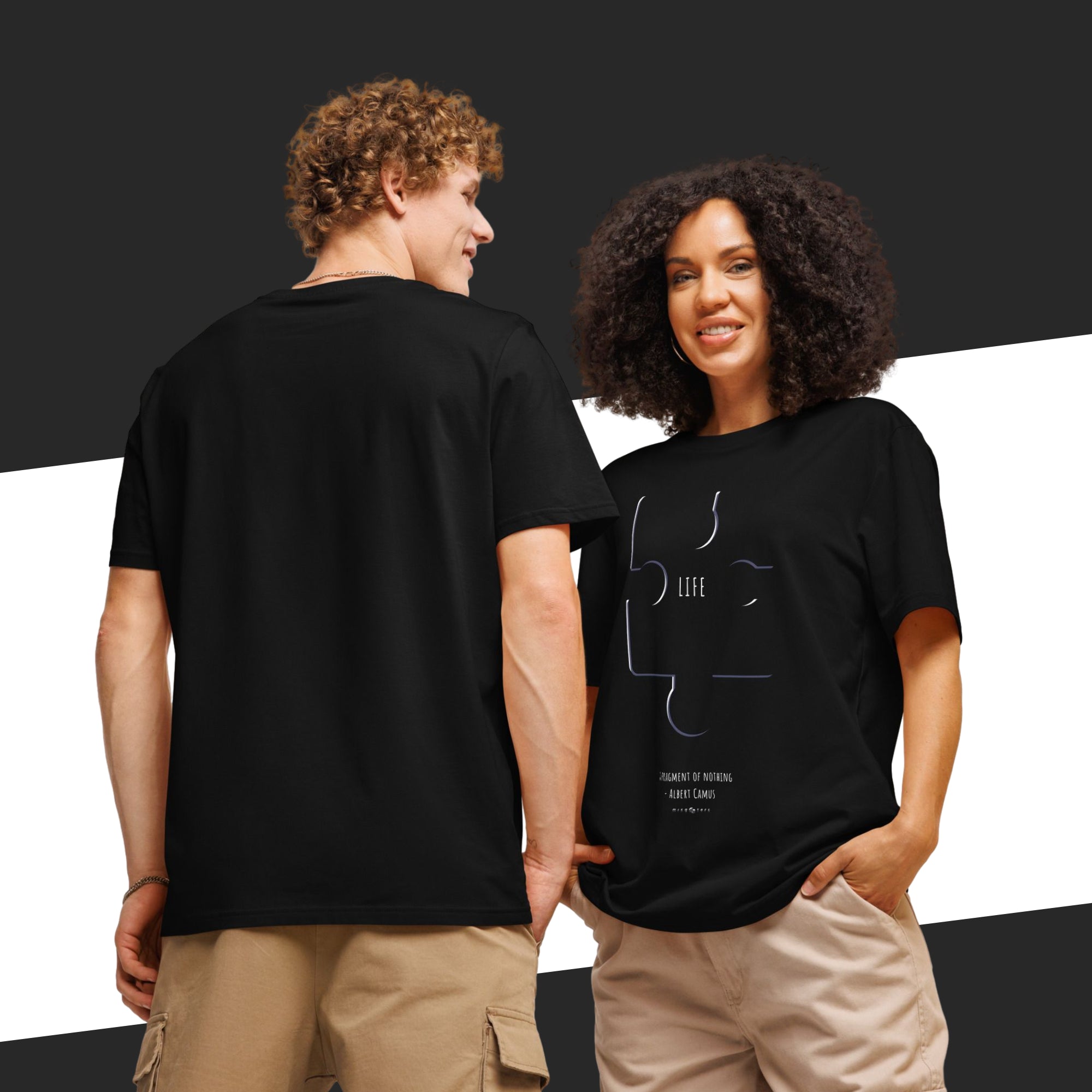 Two people wearing black t-shirts with a design on the front, one facing the camera and the other back.